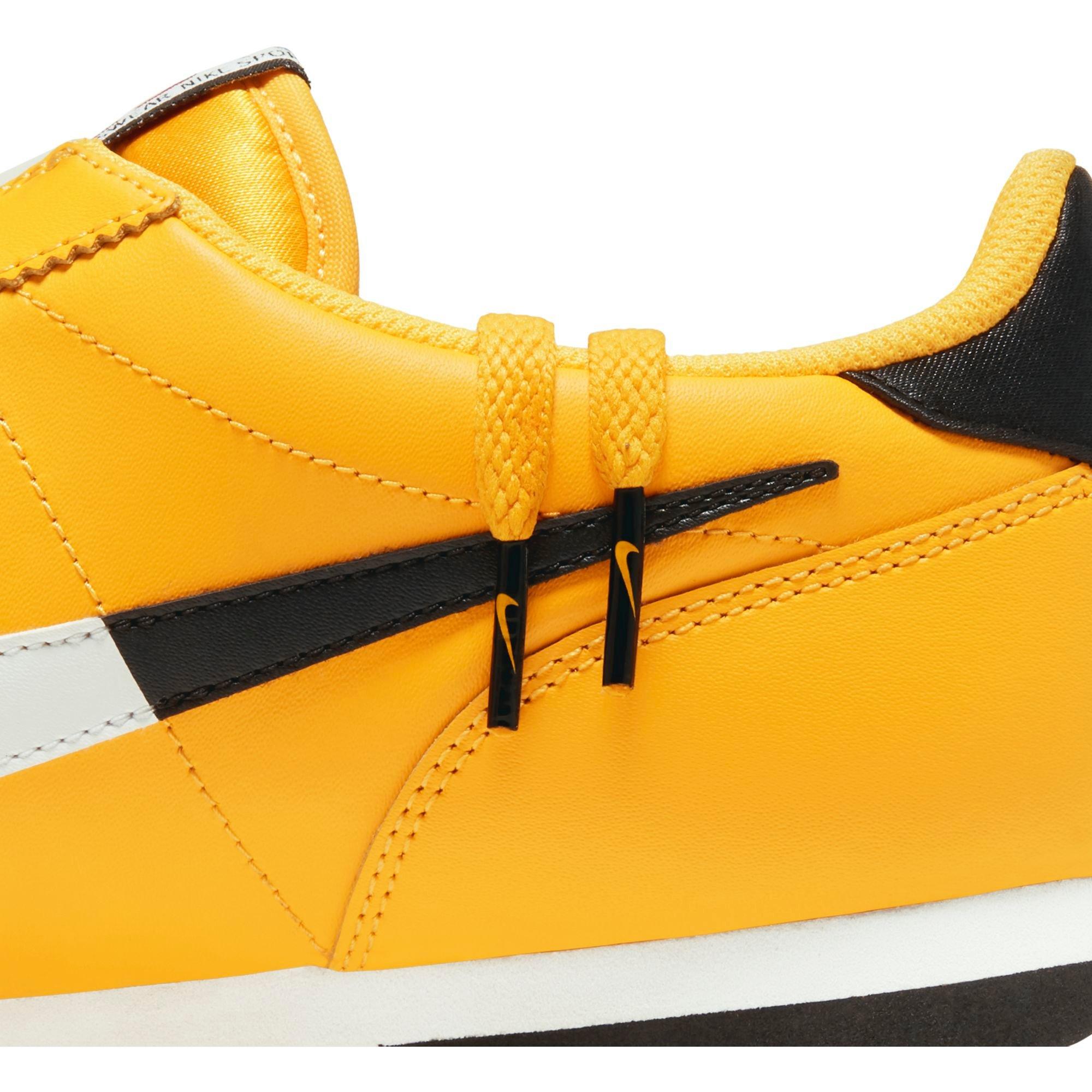 nike cortez yellow black
