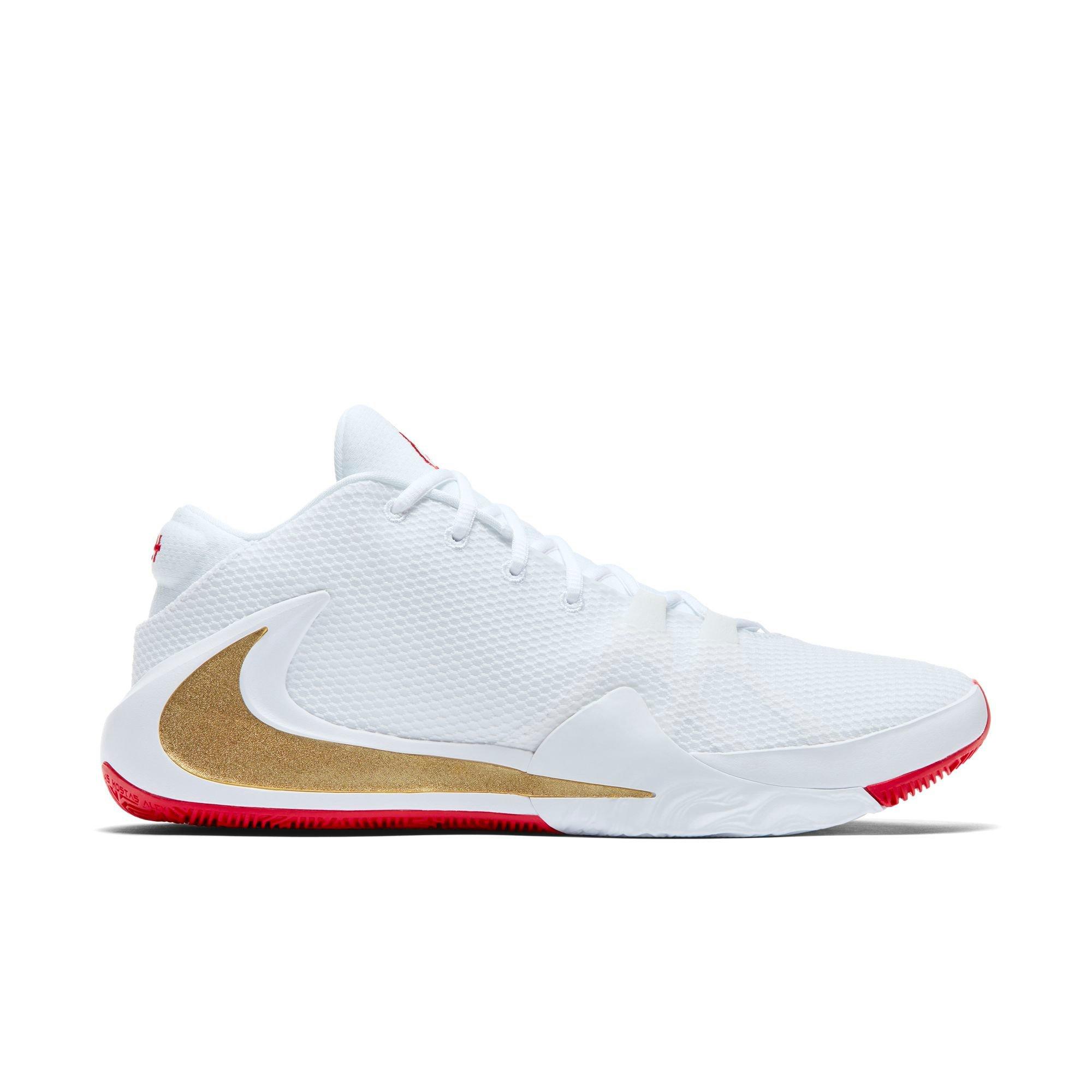 gold and white basketball shoes