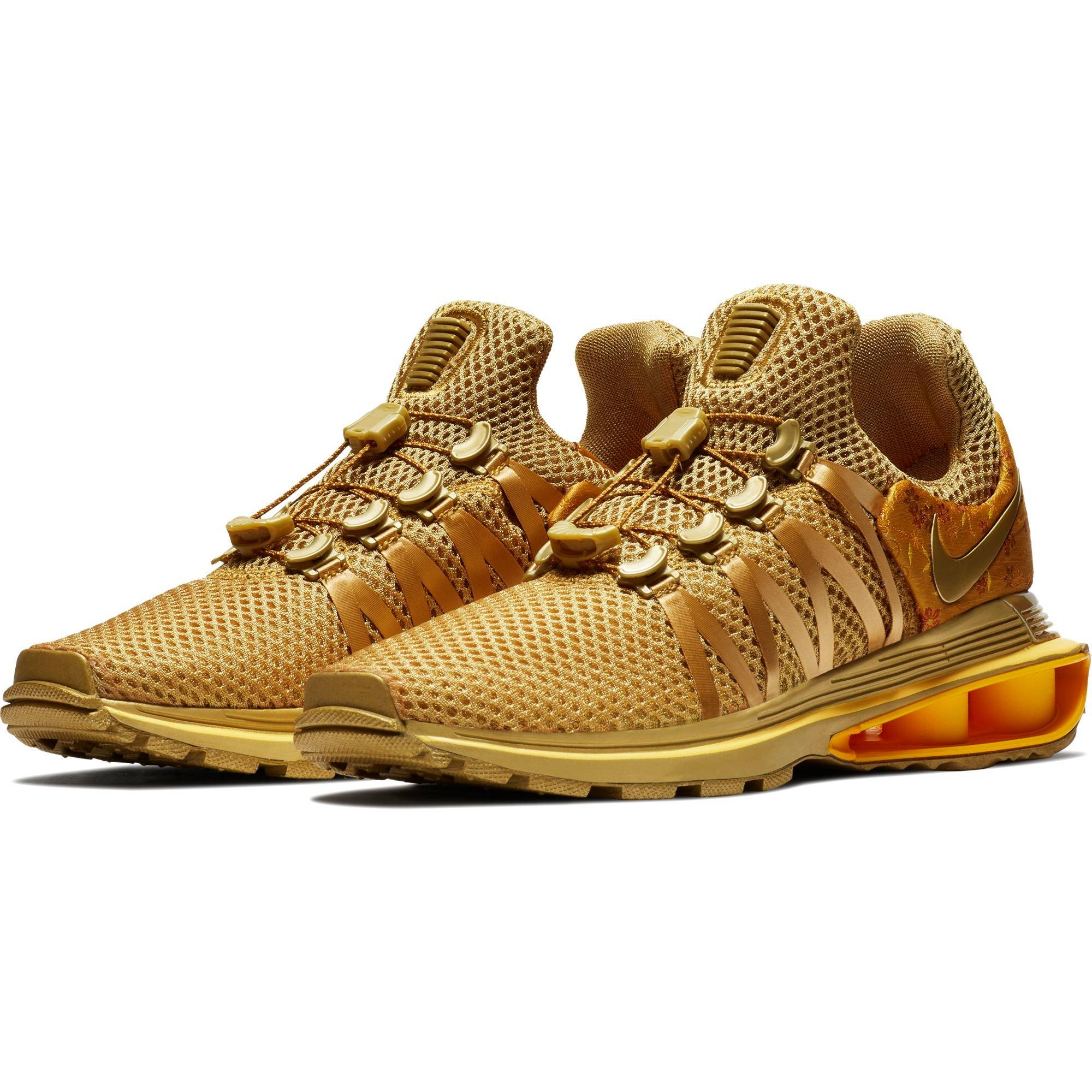 nike shox gravity metallic gold women's shoe