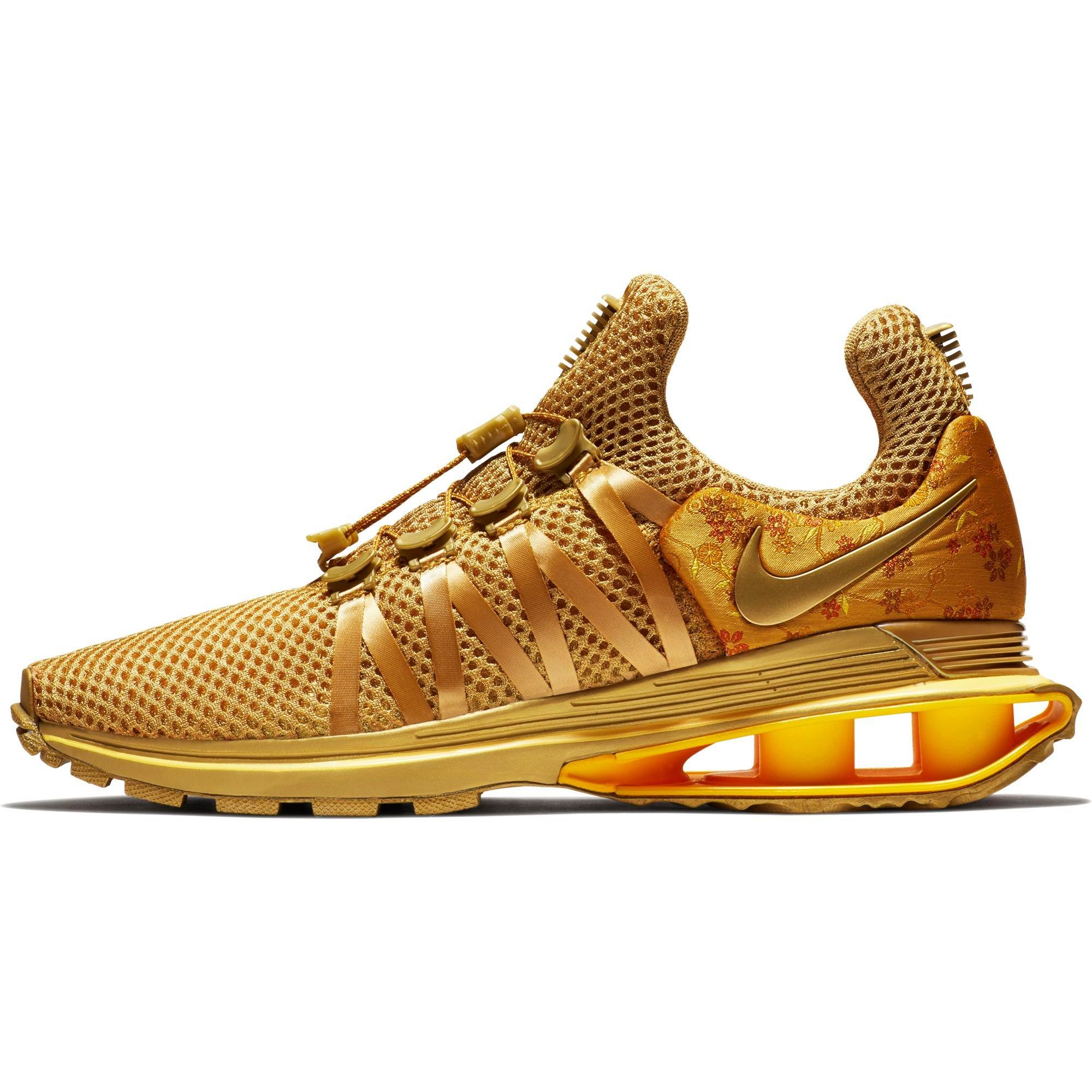 nike shox gravity metallic gold women's shoe