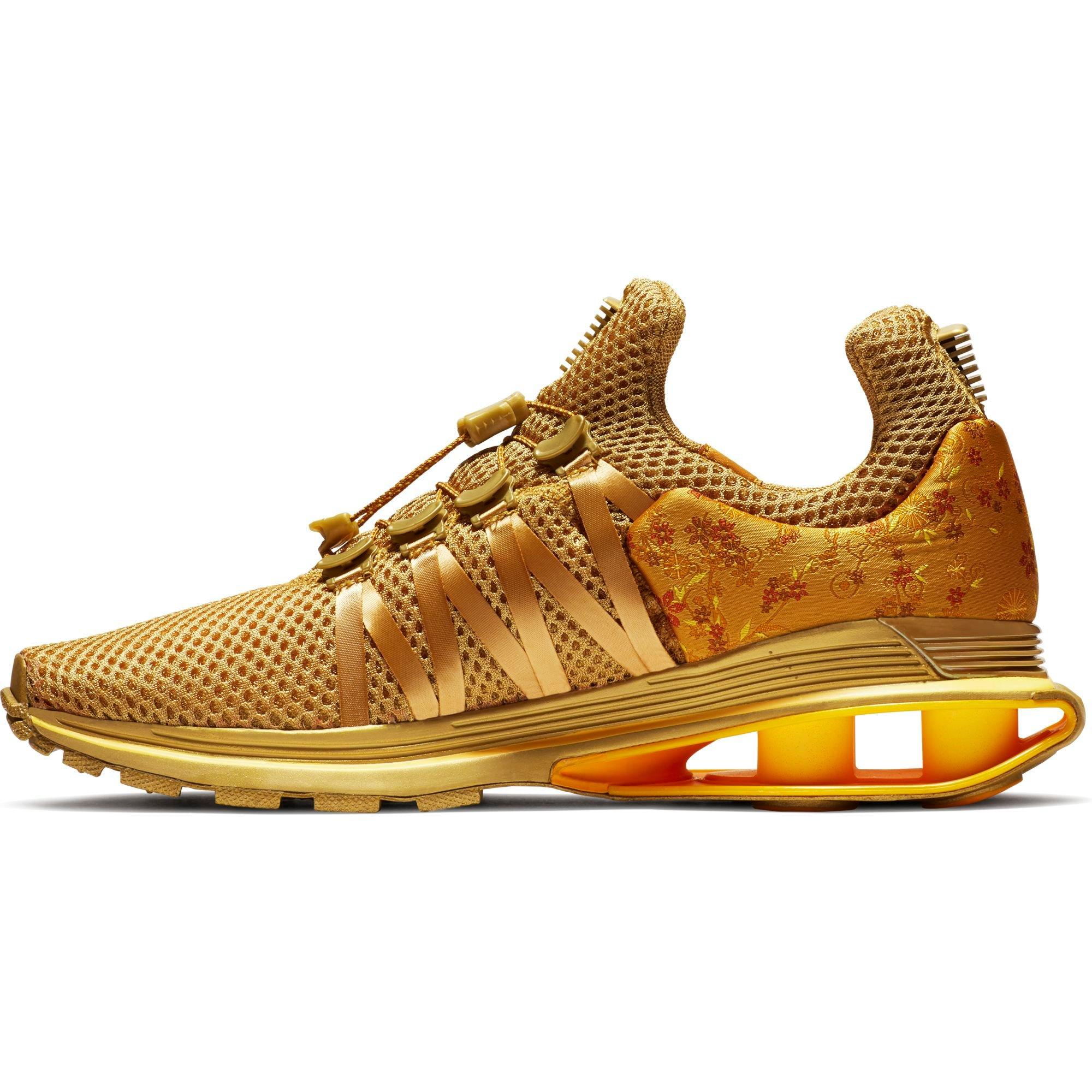 nike shox gravity women's gold