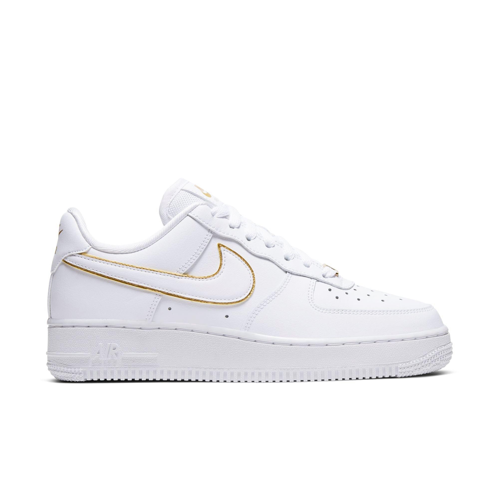 gold nike air force ones