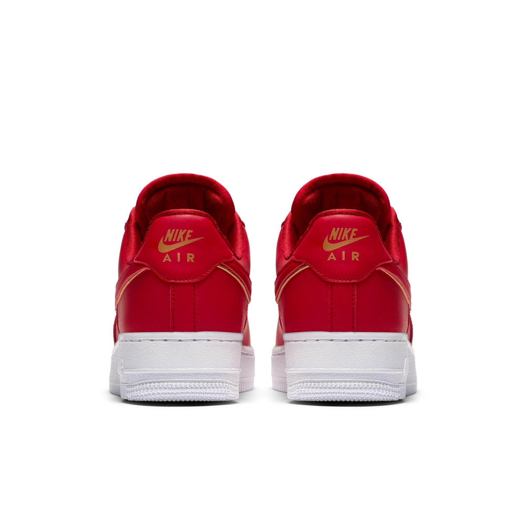 red and gold nike shoes