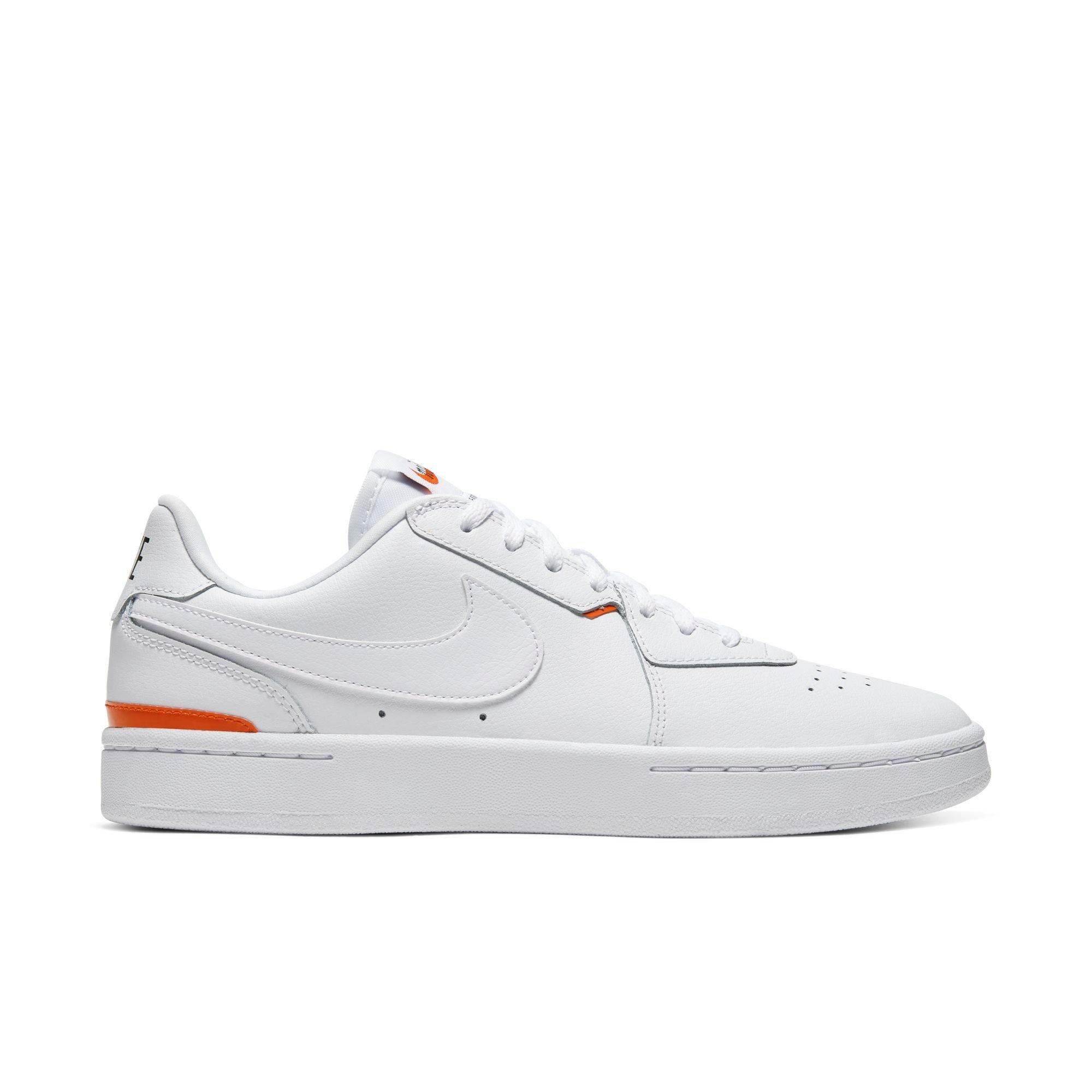 orange and white tennis shoes