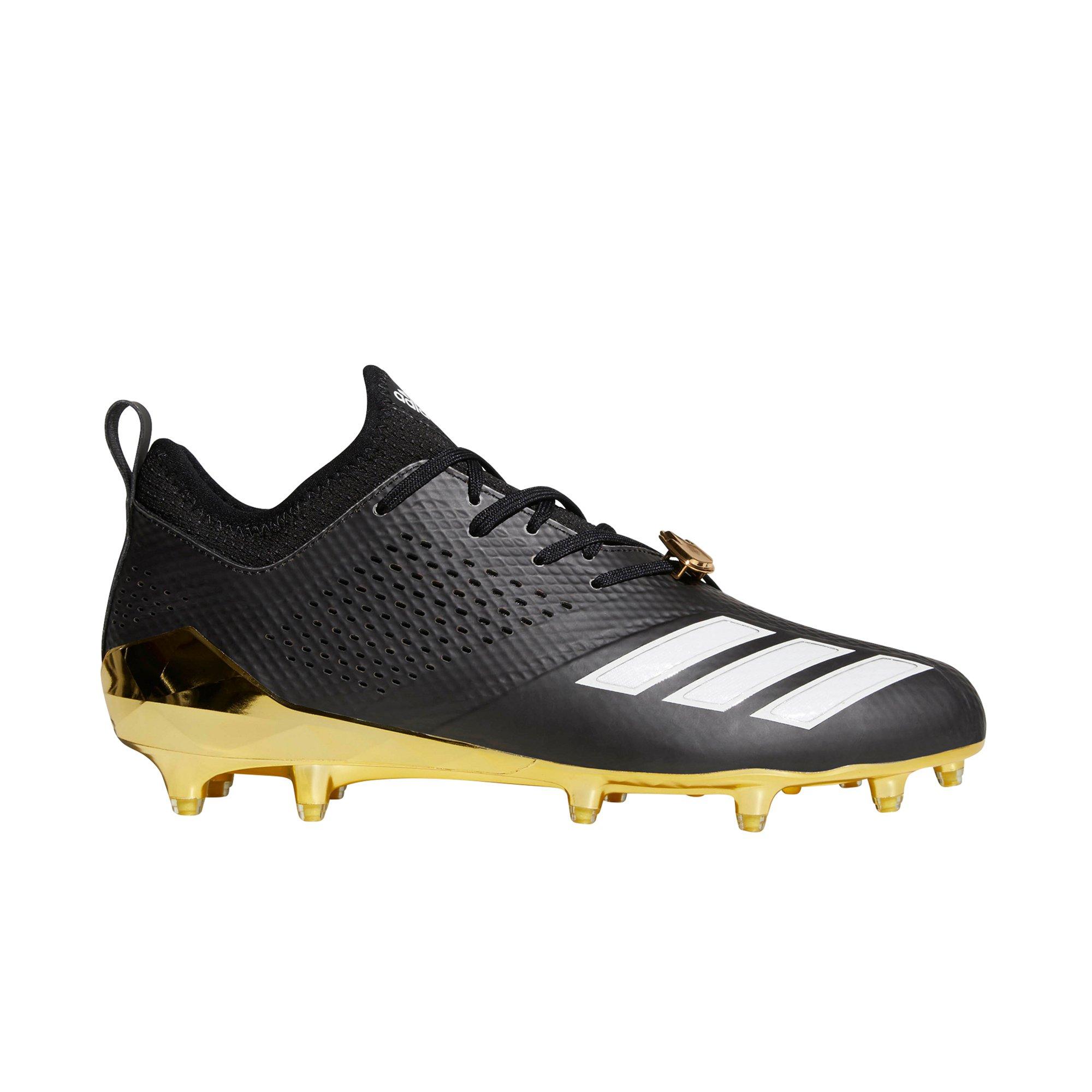 black and gold football shoes