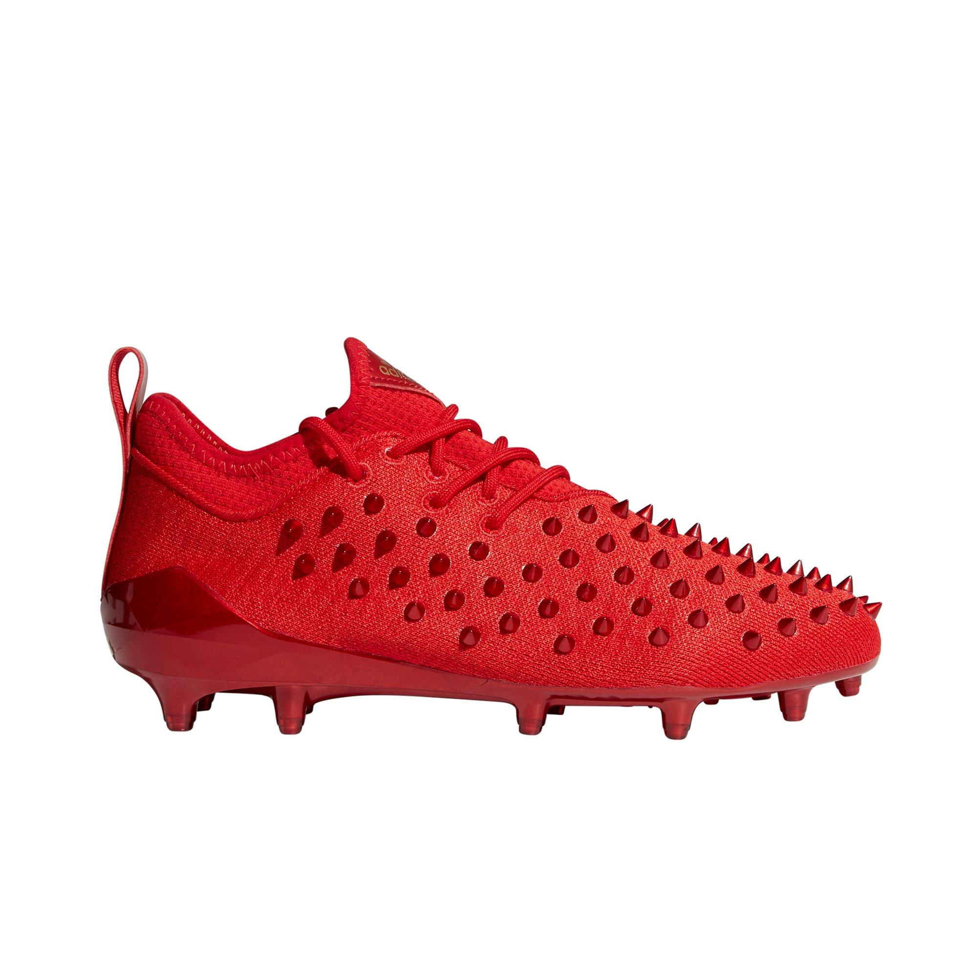 gold and red football cleats