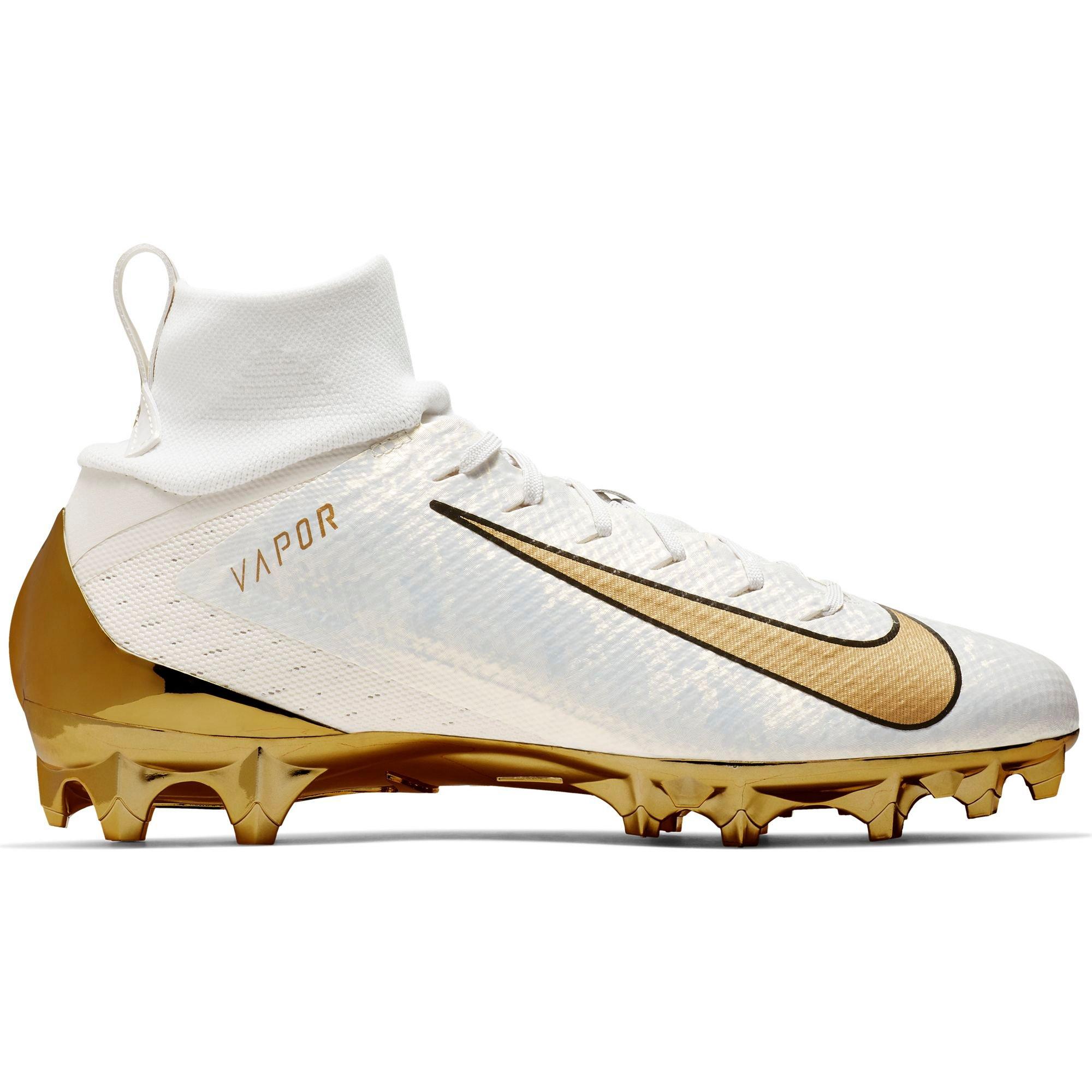 gold and white nike football cleats