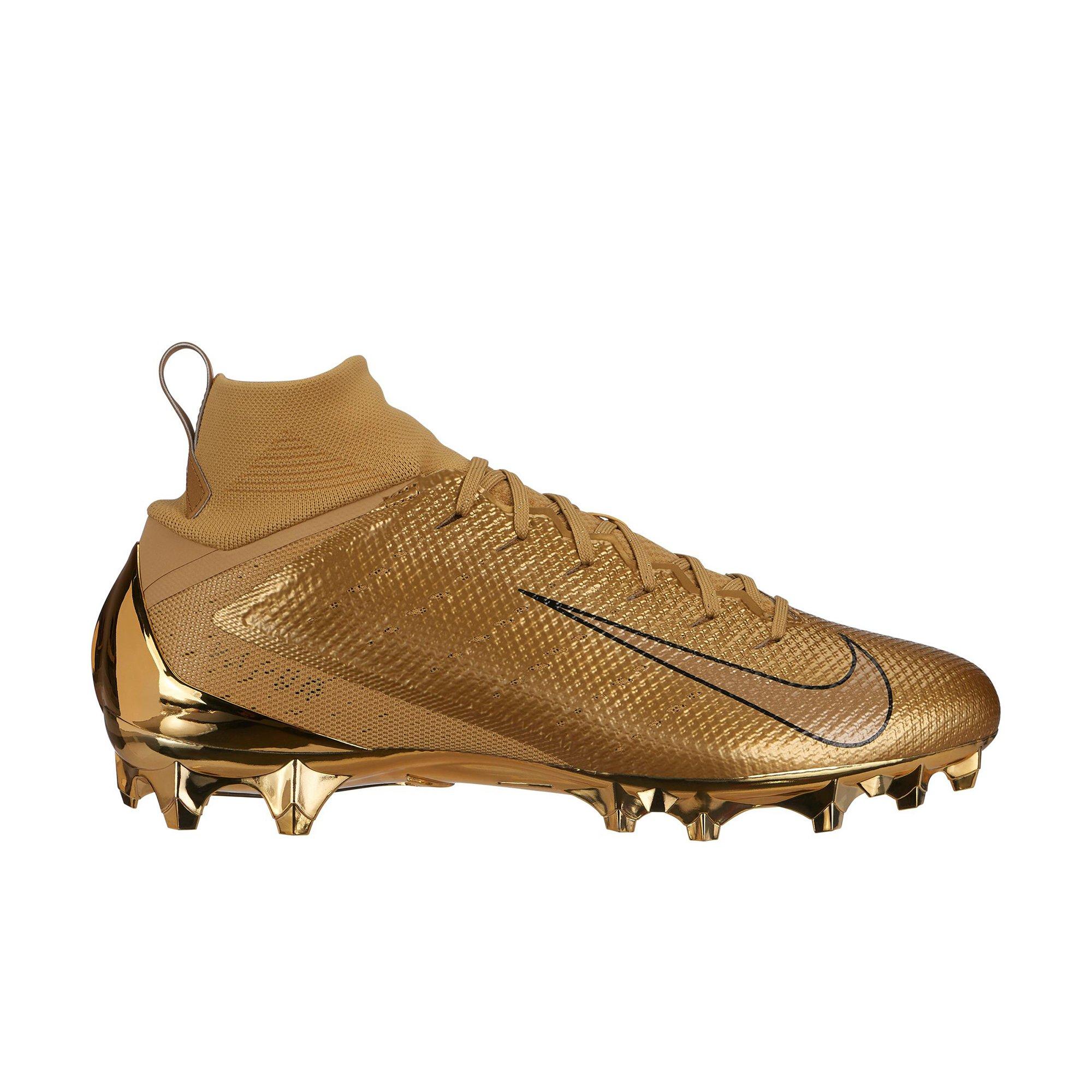 white and gold nike cleats