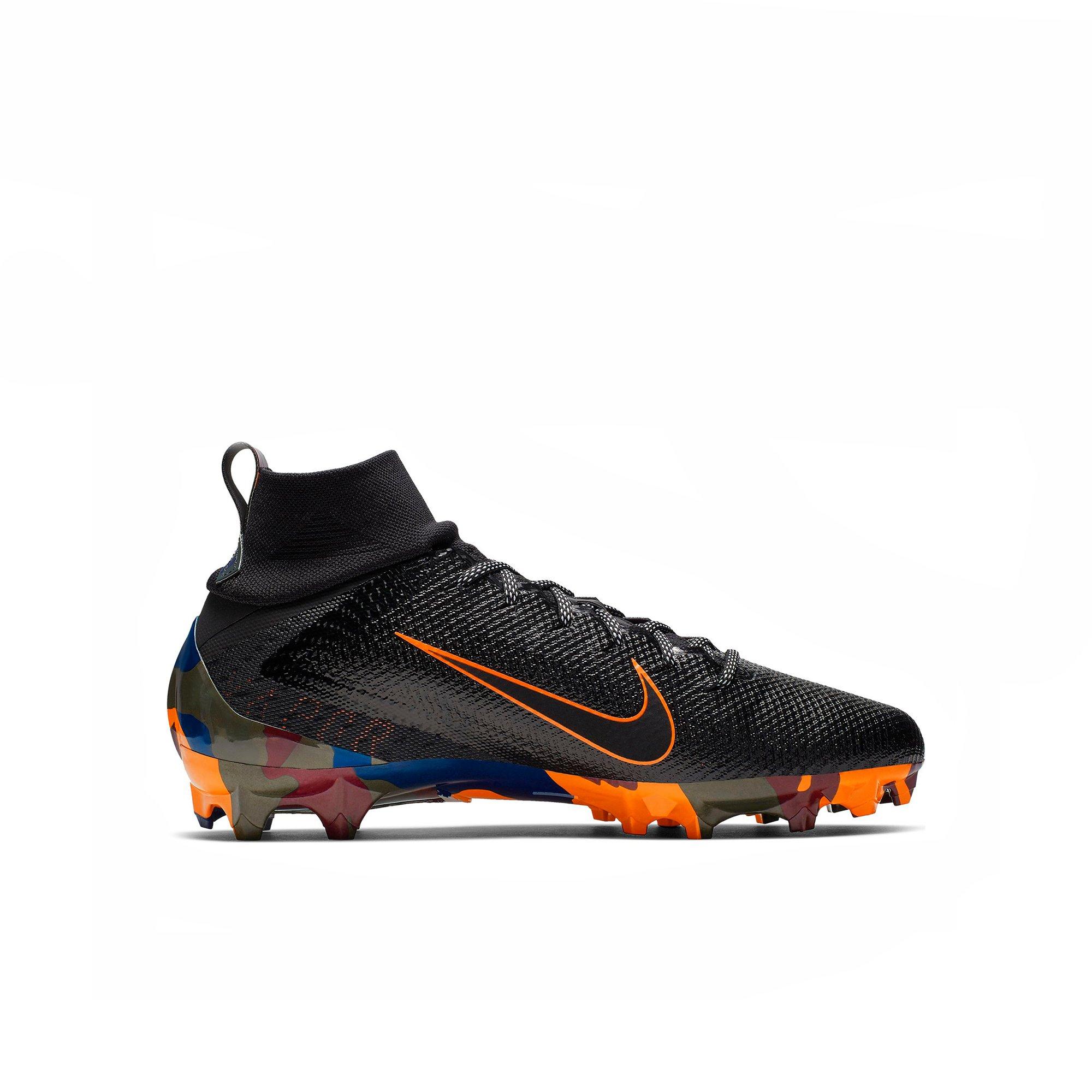 orange and black football cleats