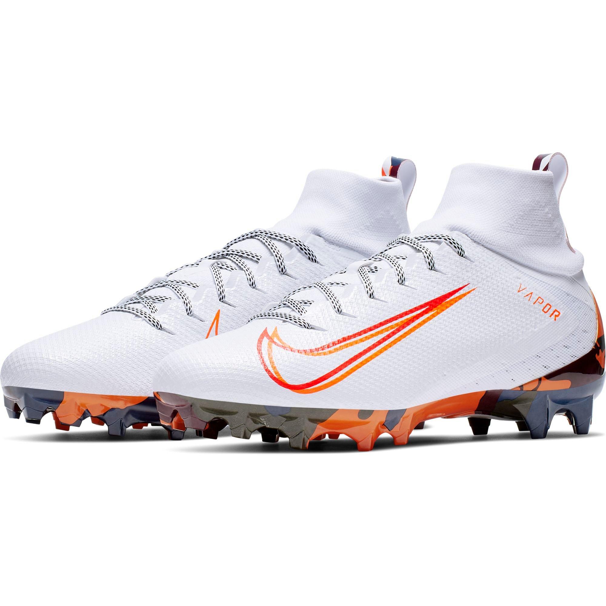 white and orange football cleats