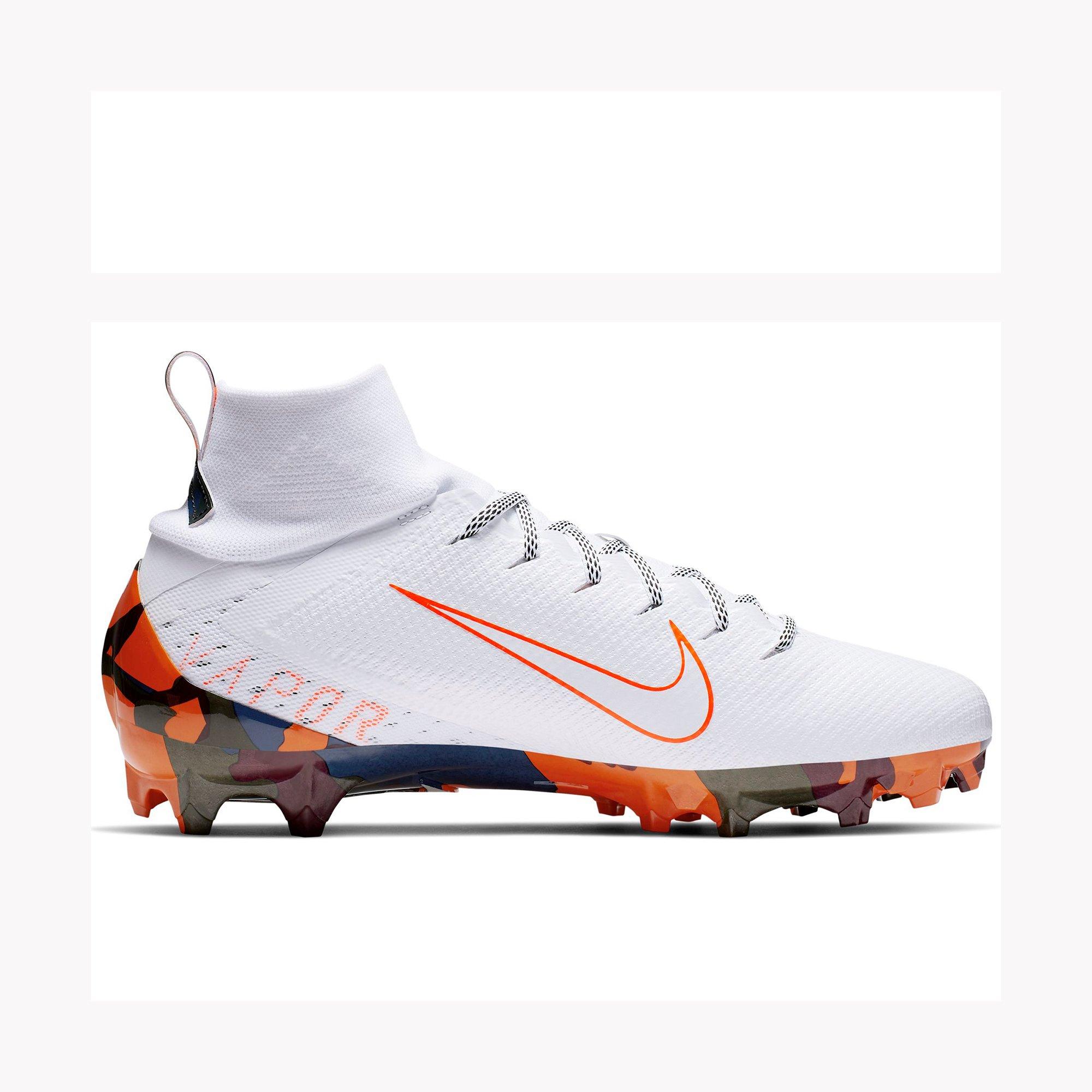 orange and white football cleats