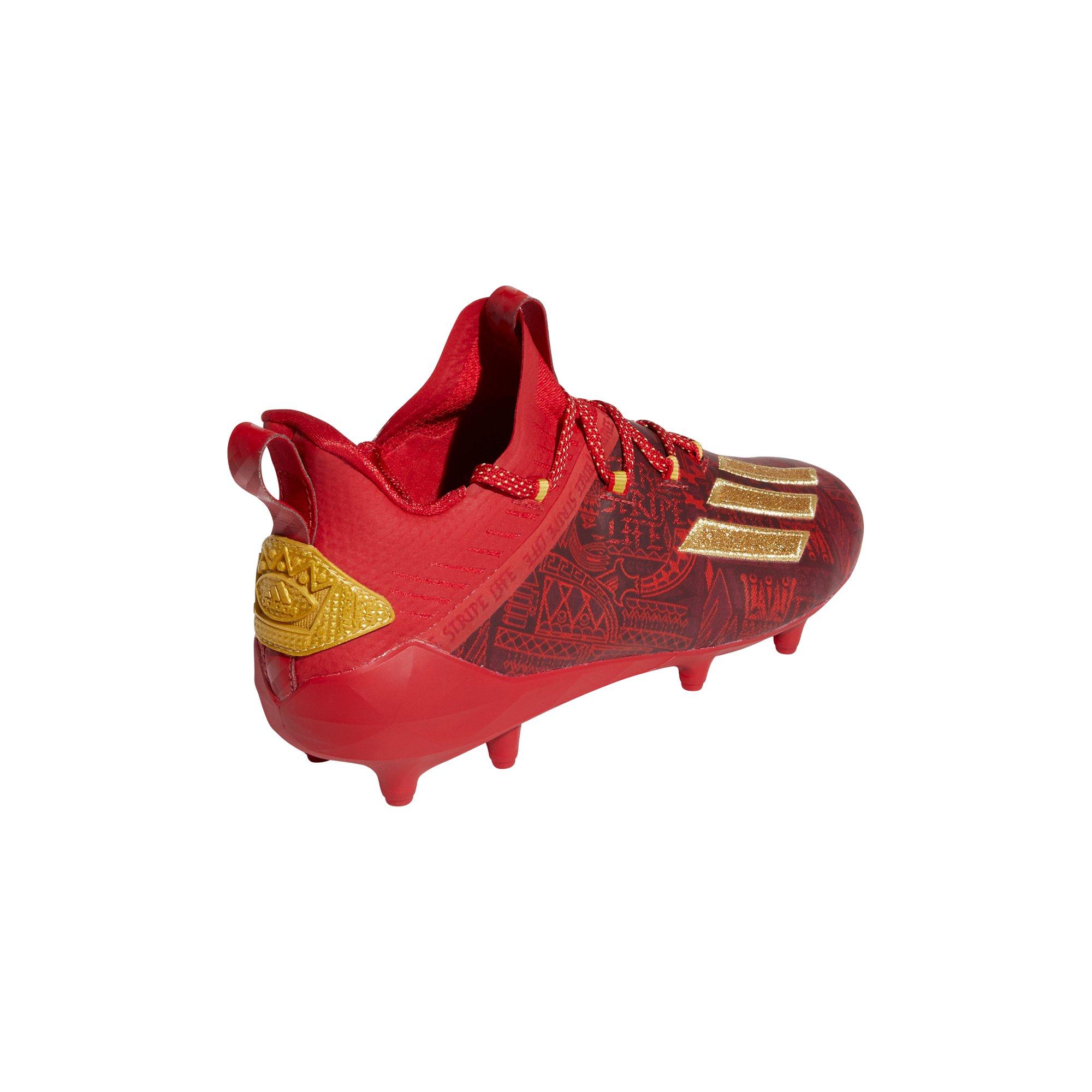 red and gold adidas football cleats