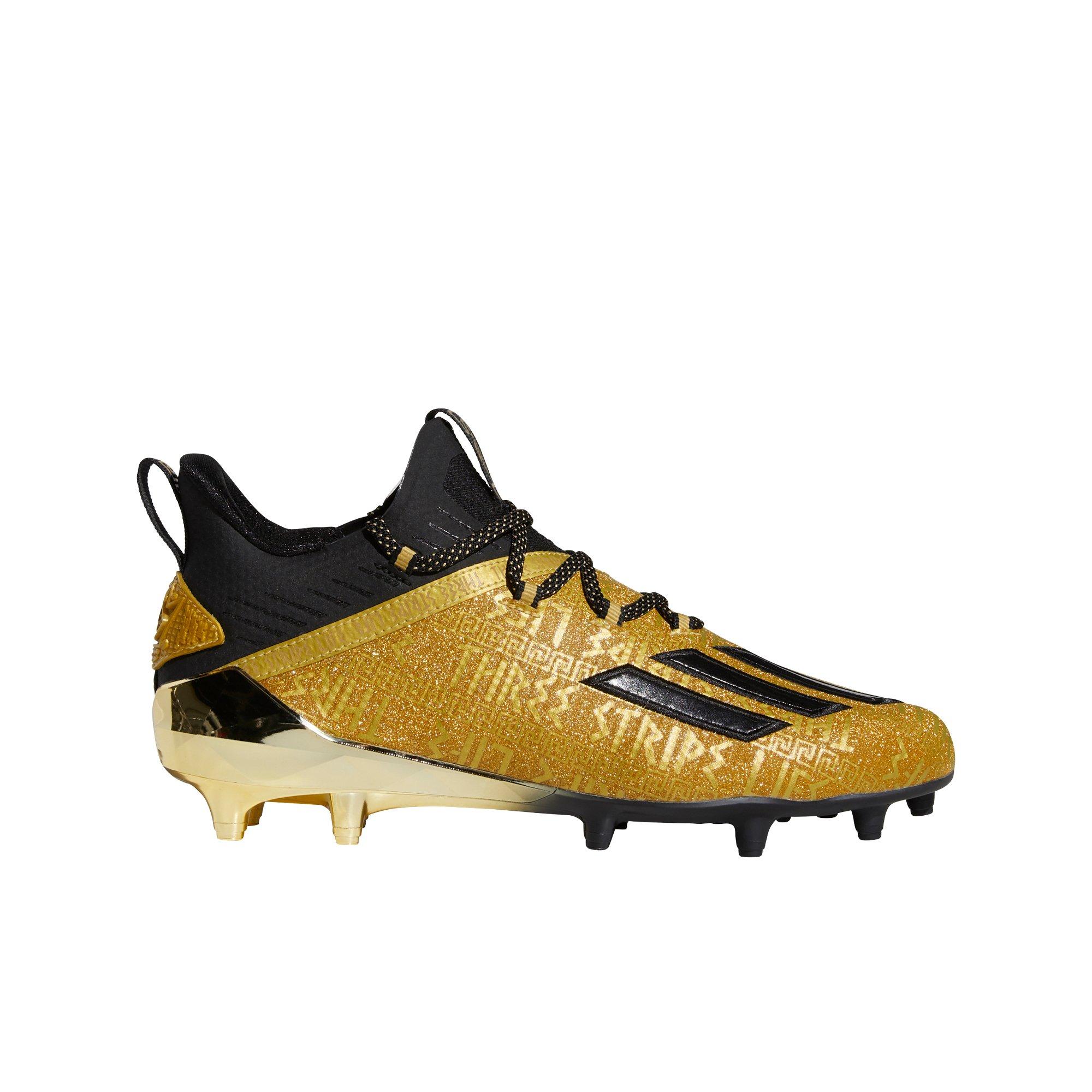 gold and black youth football cleats