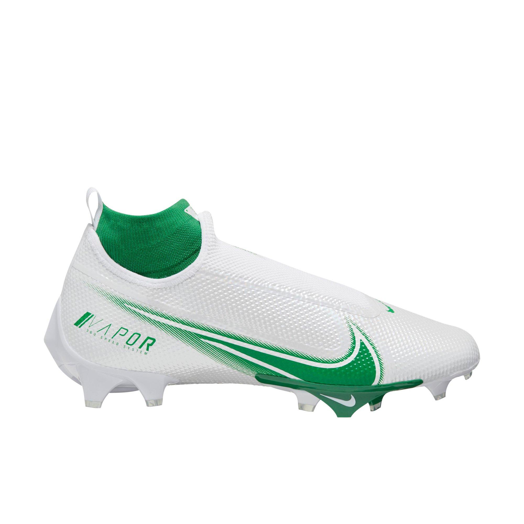 white and green football cleats