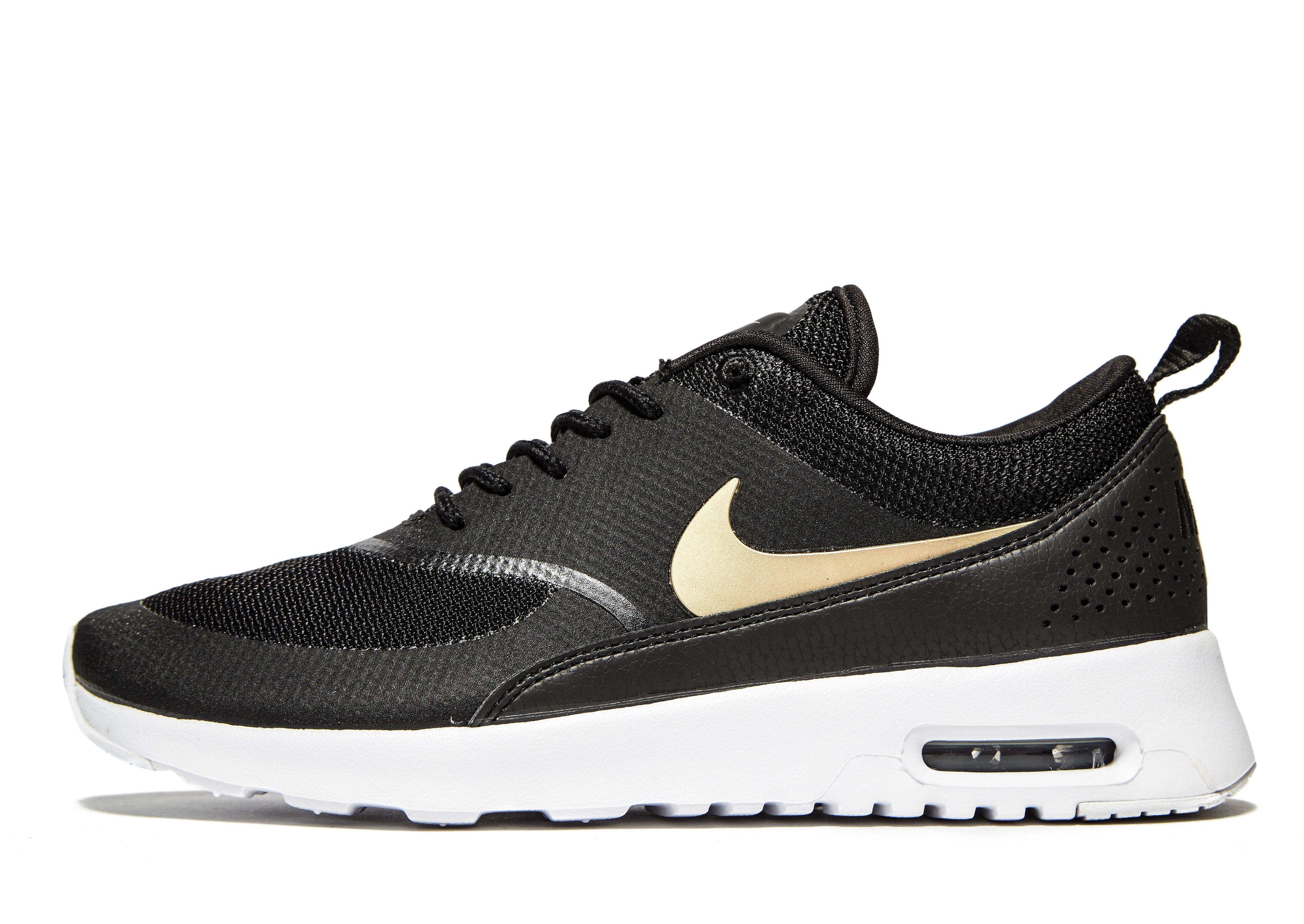 nike thea womens black and gold