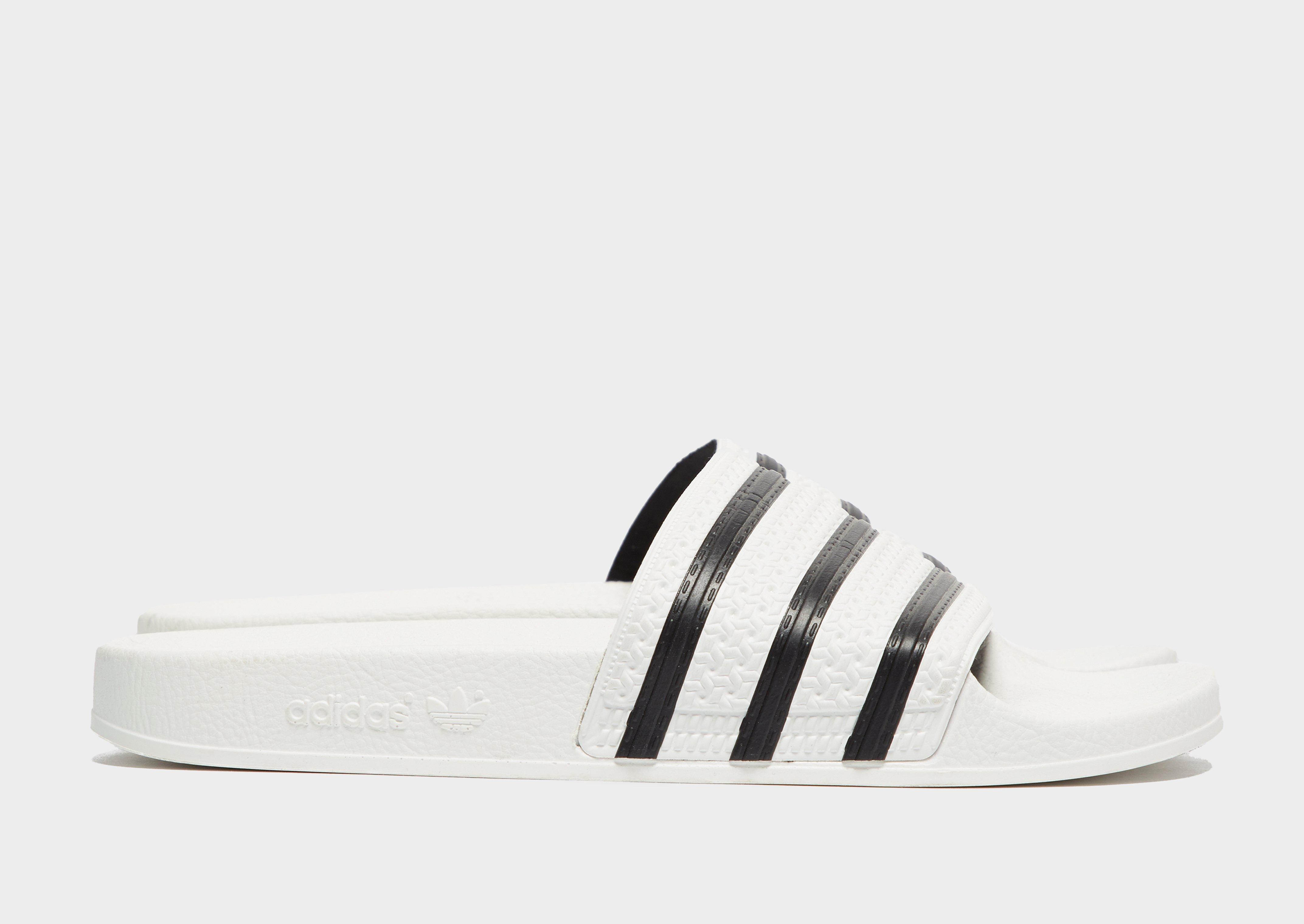 Férfi papucsok és flip-flopok ADIDAS ADILETTE  280648 Fehér