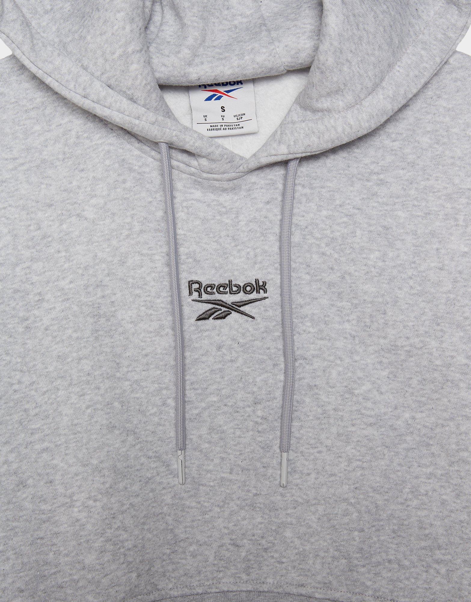 Moteriškas džemperis REEBOK DŽEMPERIS SU GOBTUVU   WARDROBE ESSENTIALS CROP 100253820 Pilka