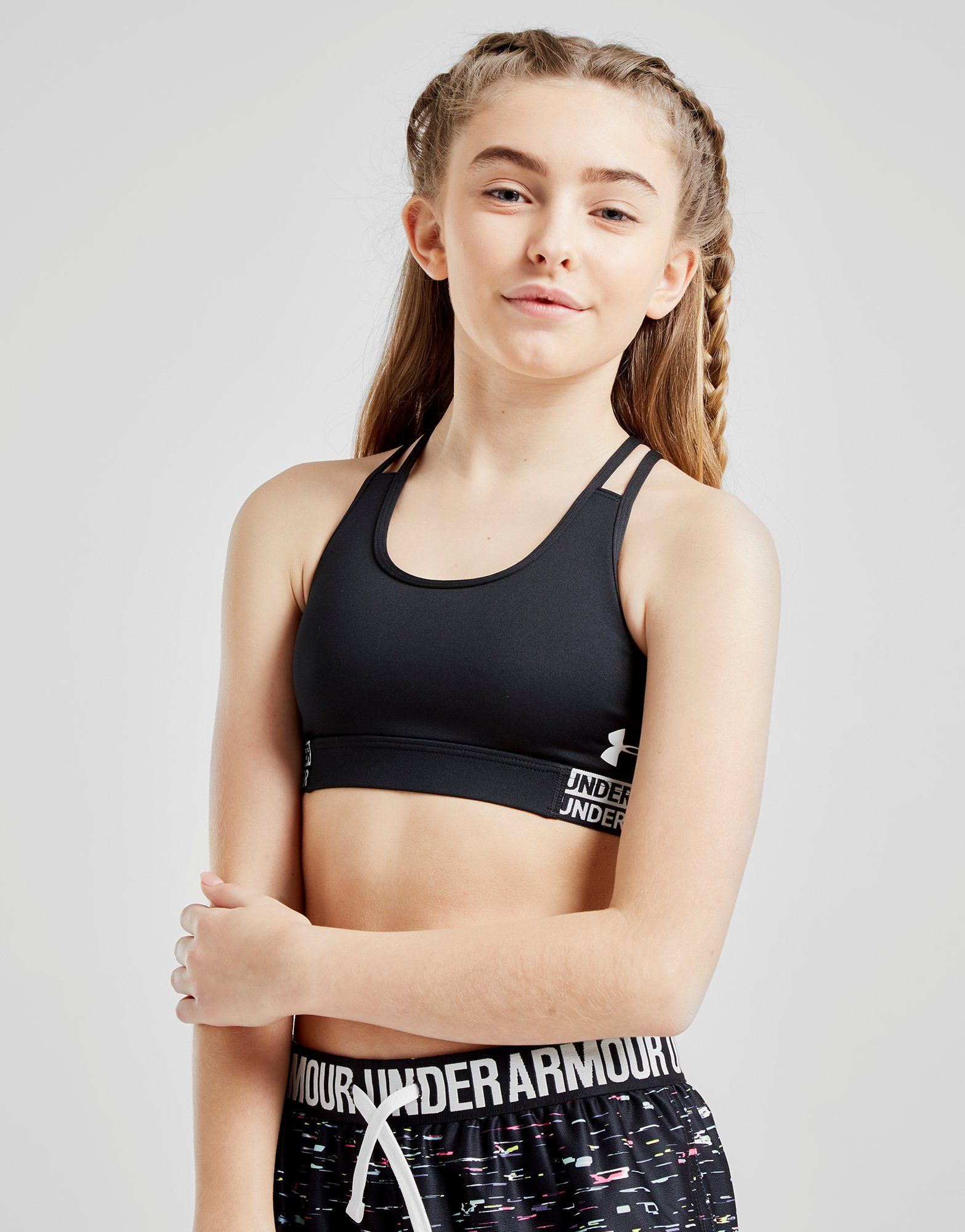 teen girl wearing black sports bra racerback