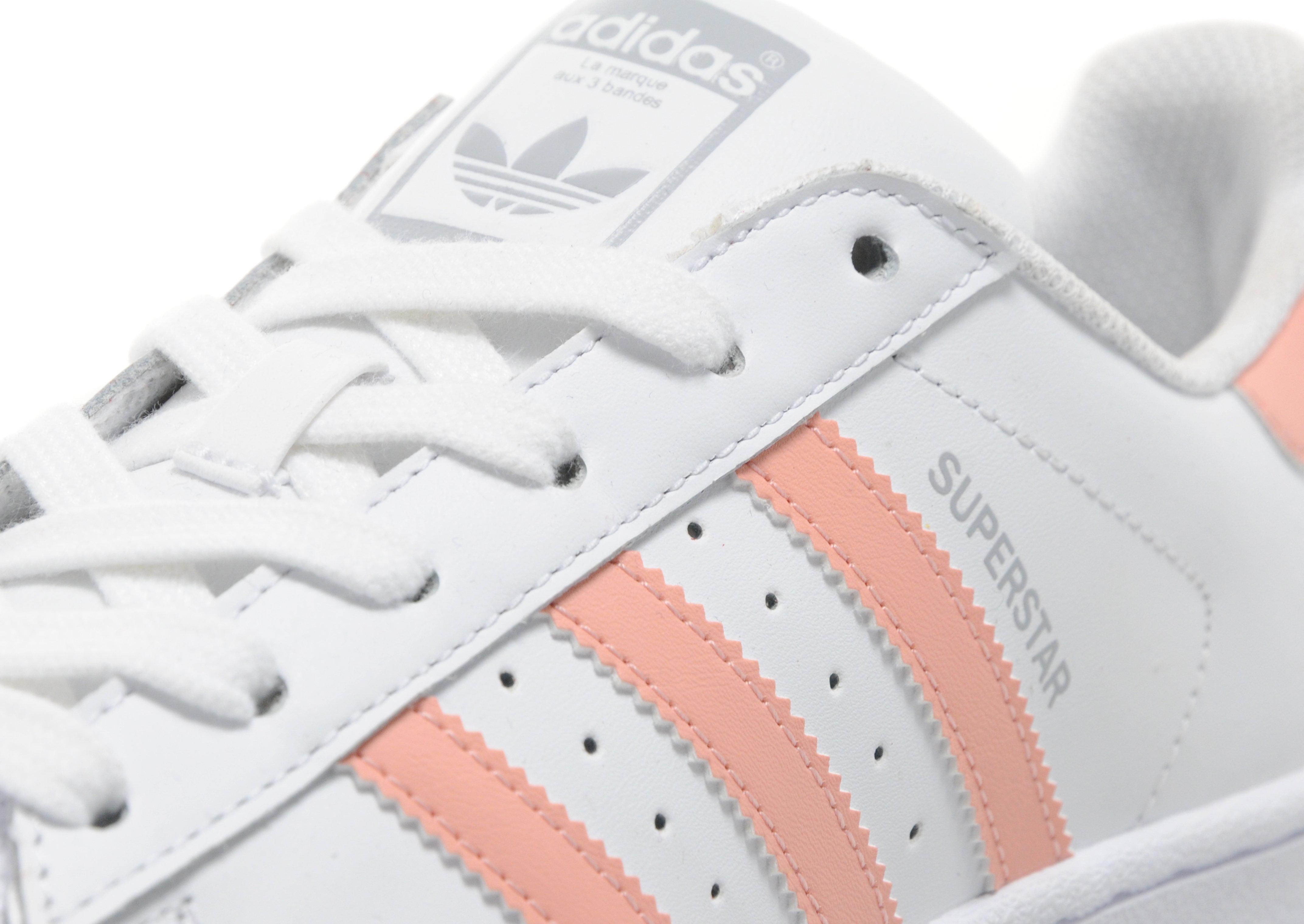 grey adidas trainers with pink stripes