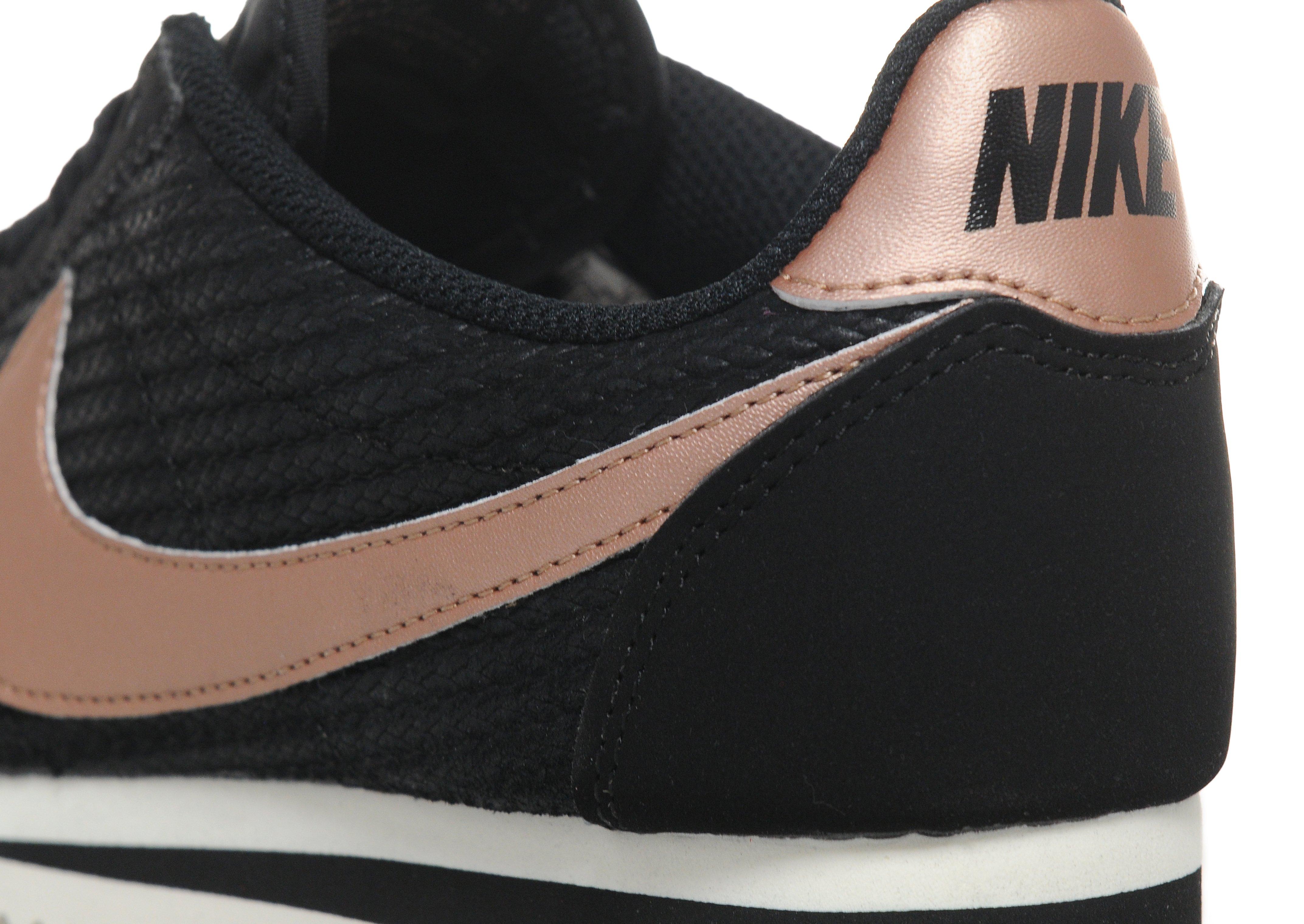 nike black & gold cortez suede trainers