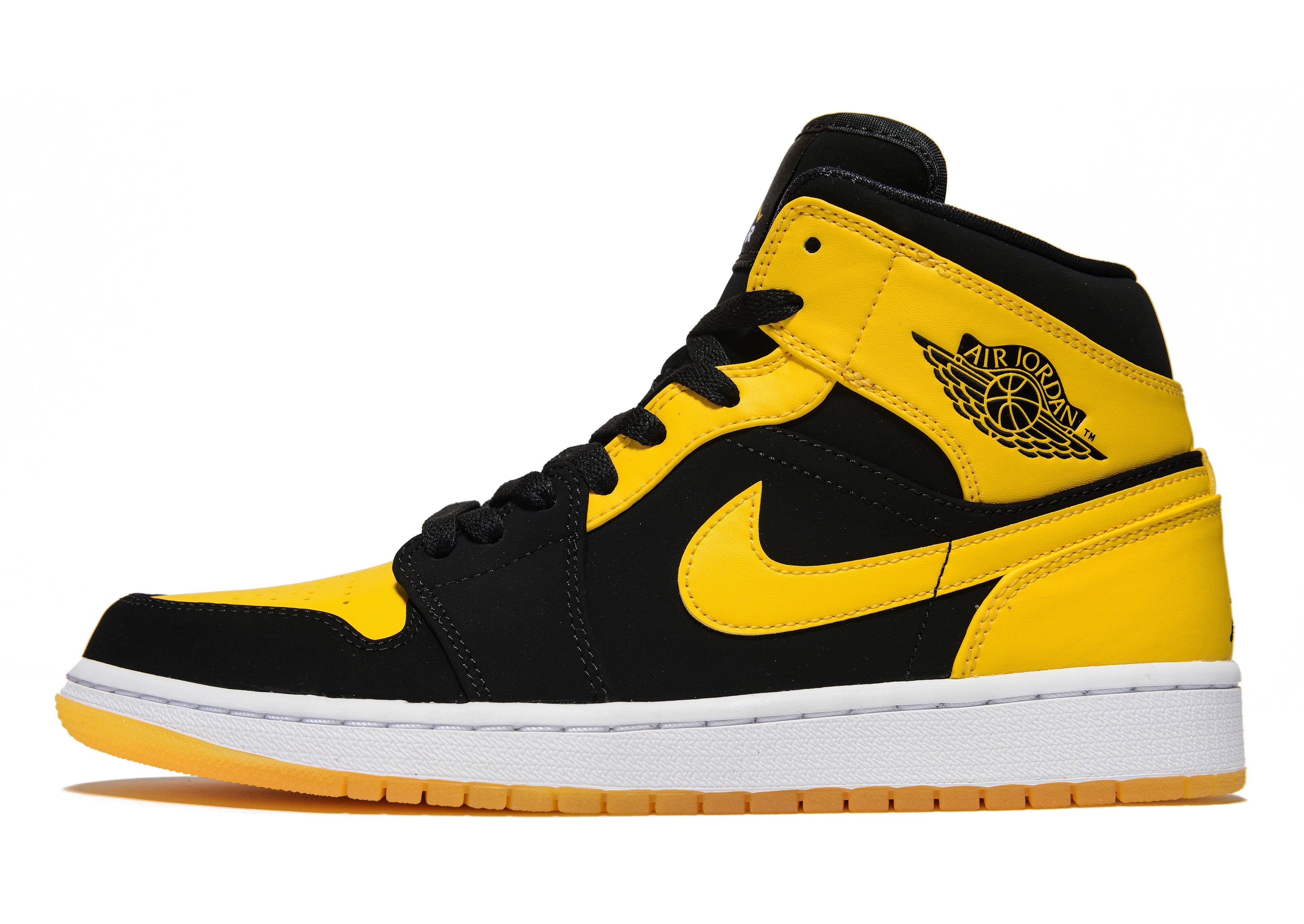 black and yellow high top forces