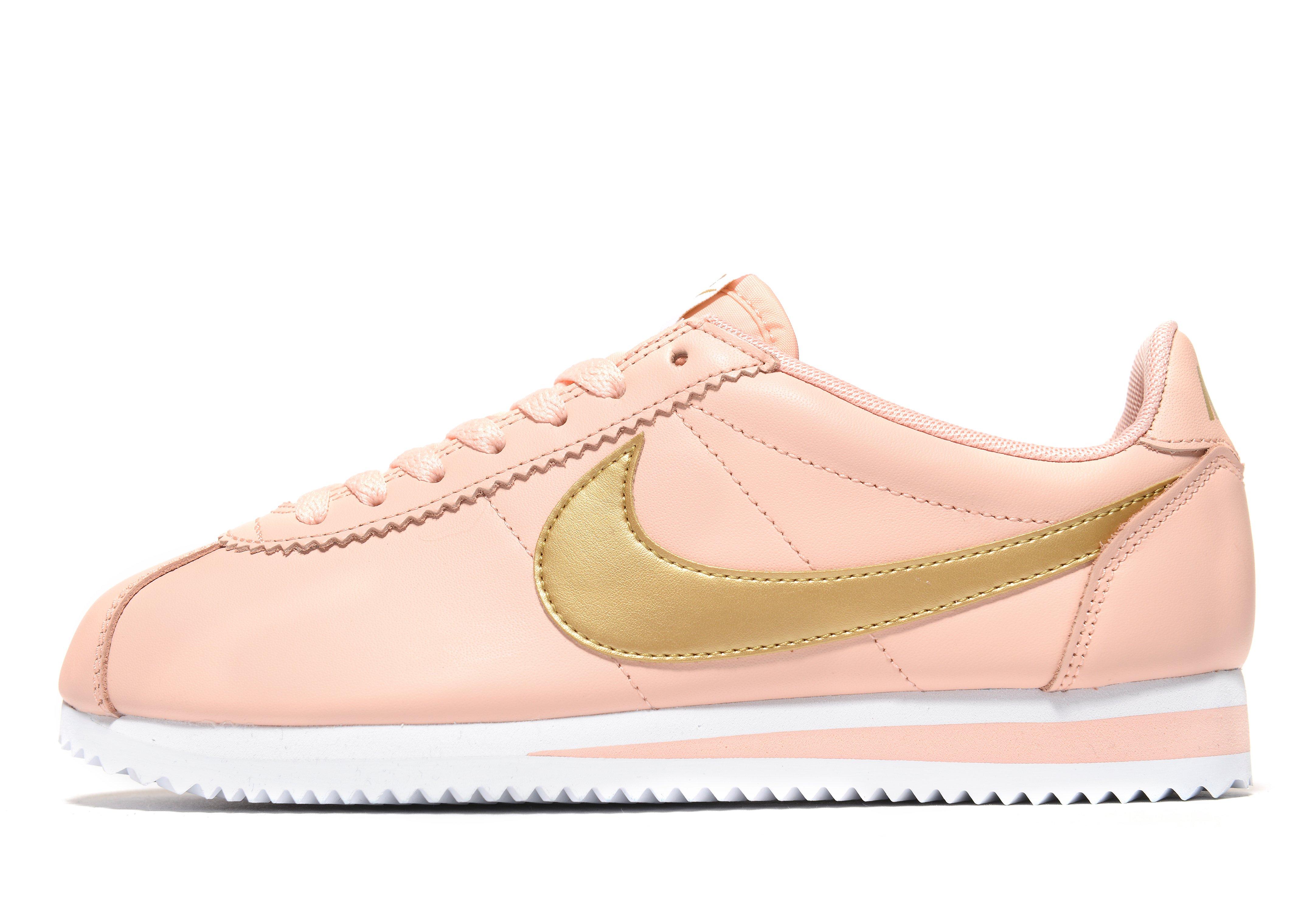 pink and gold nike cortez