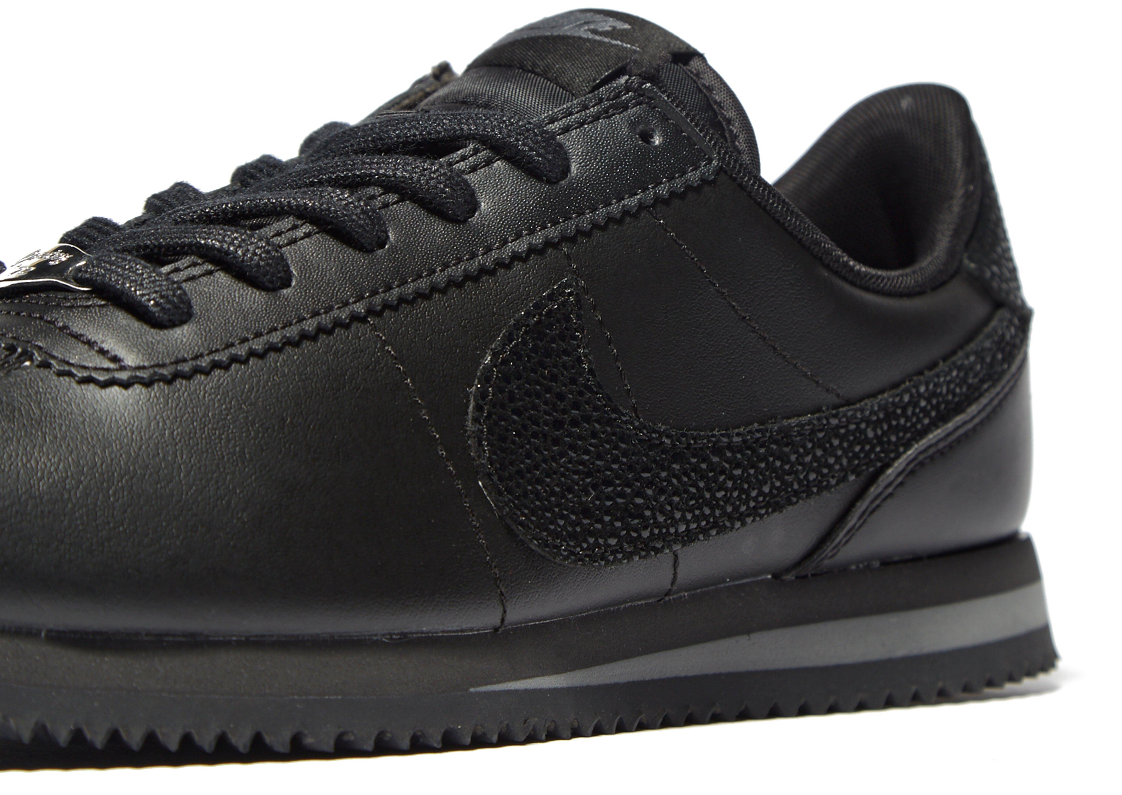 nike cortez black junior