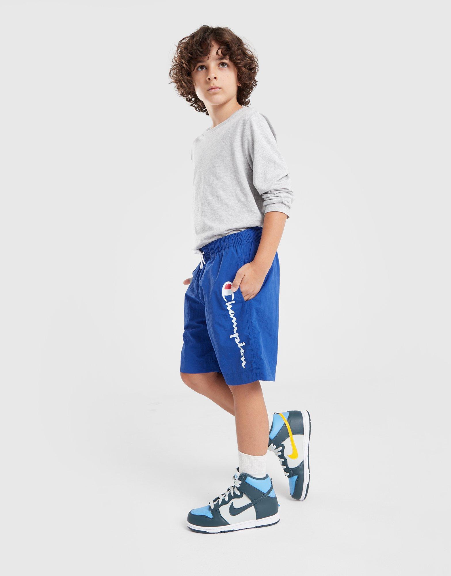 Pantaloni scurți pentru copii CHAMPION PANTALONI SCURȚI BEACHSHORT B 306771BS003 Albastru