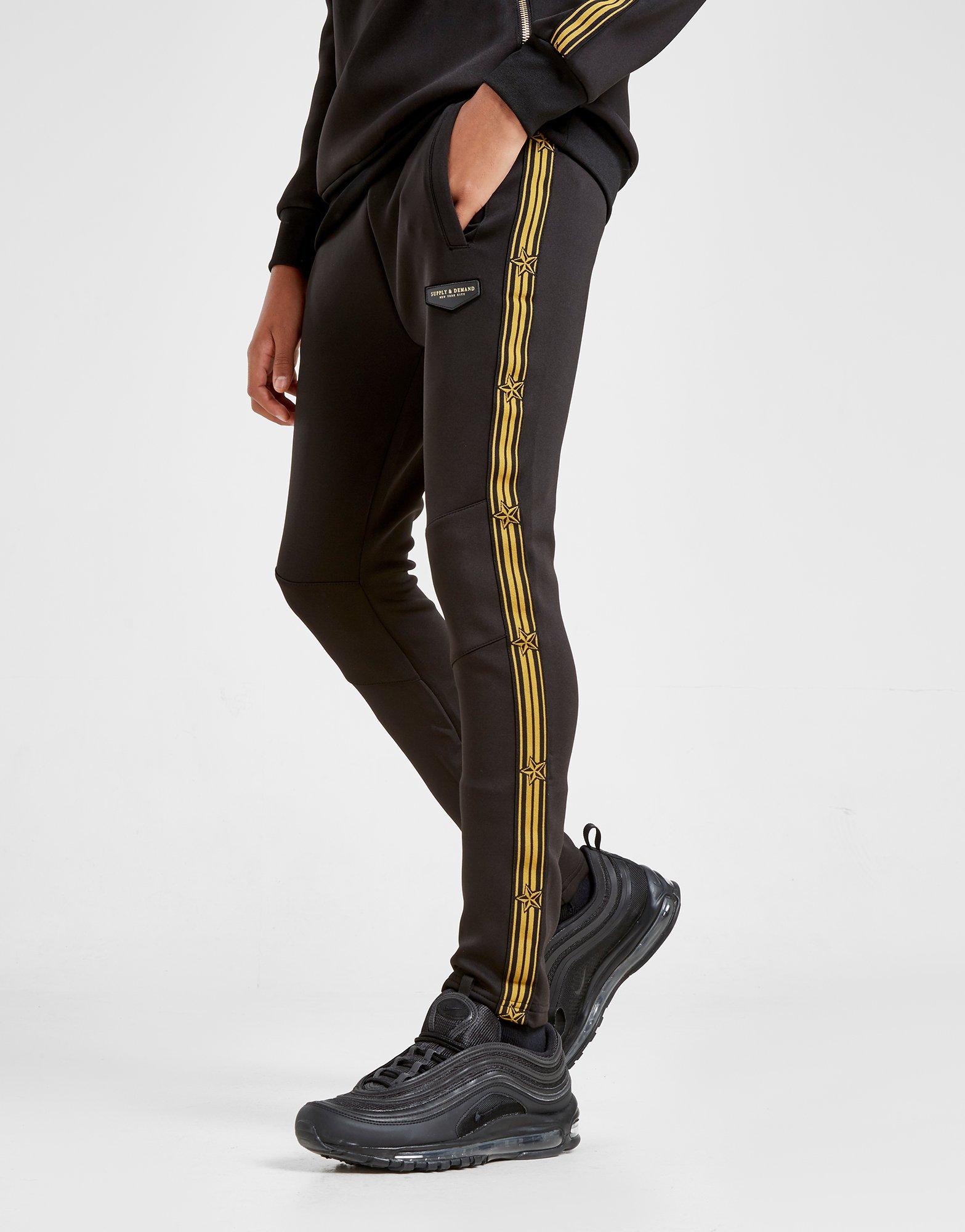 black and gold supply and demand tracksuit