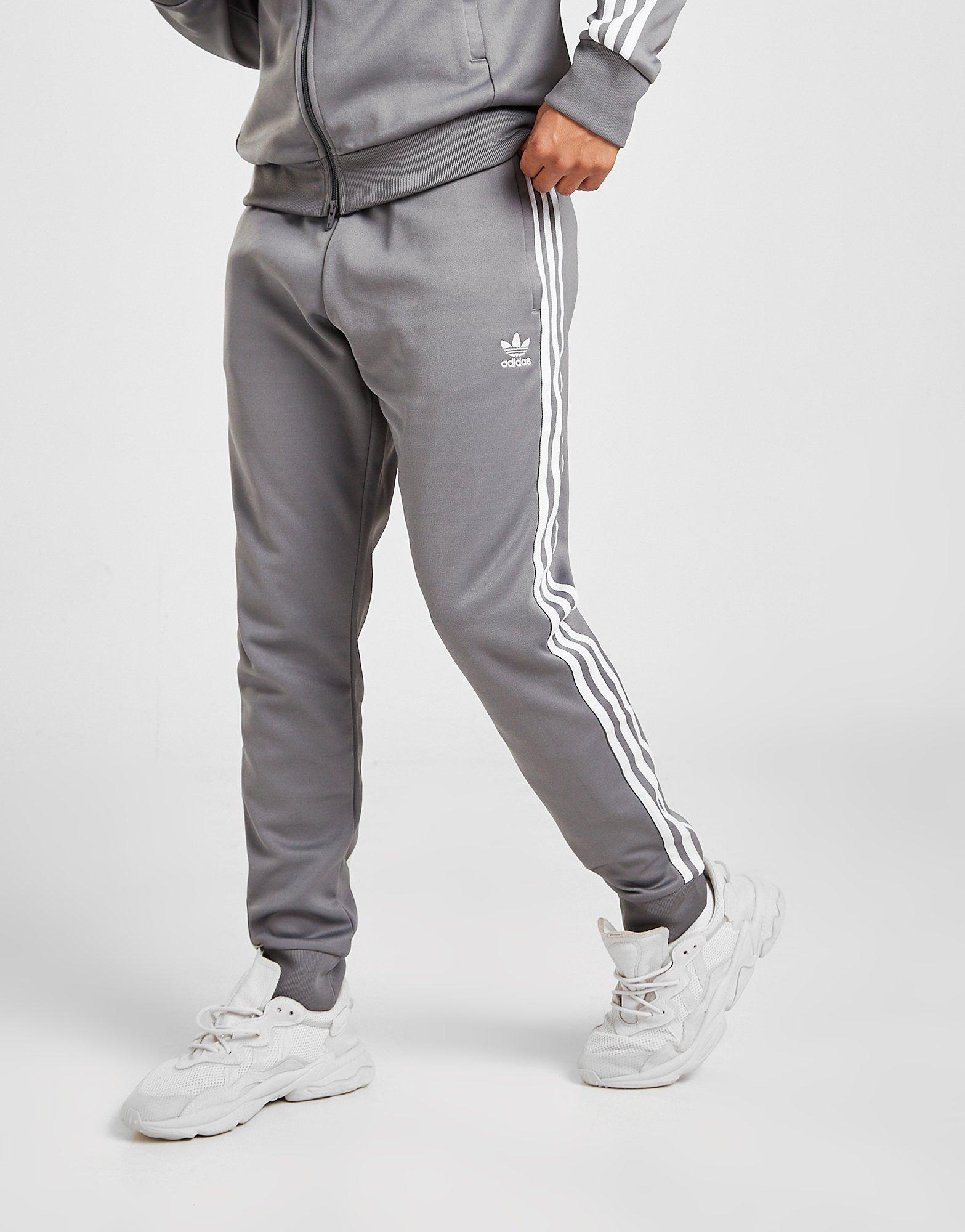 Pánske nohavice ADIDAS NOHAVICE  SS TRACK PANTS HB5900 Sivá