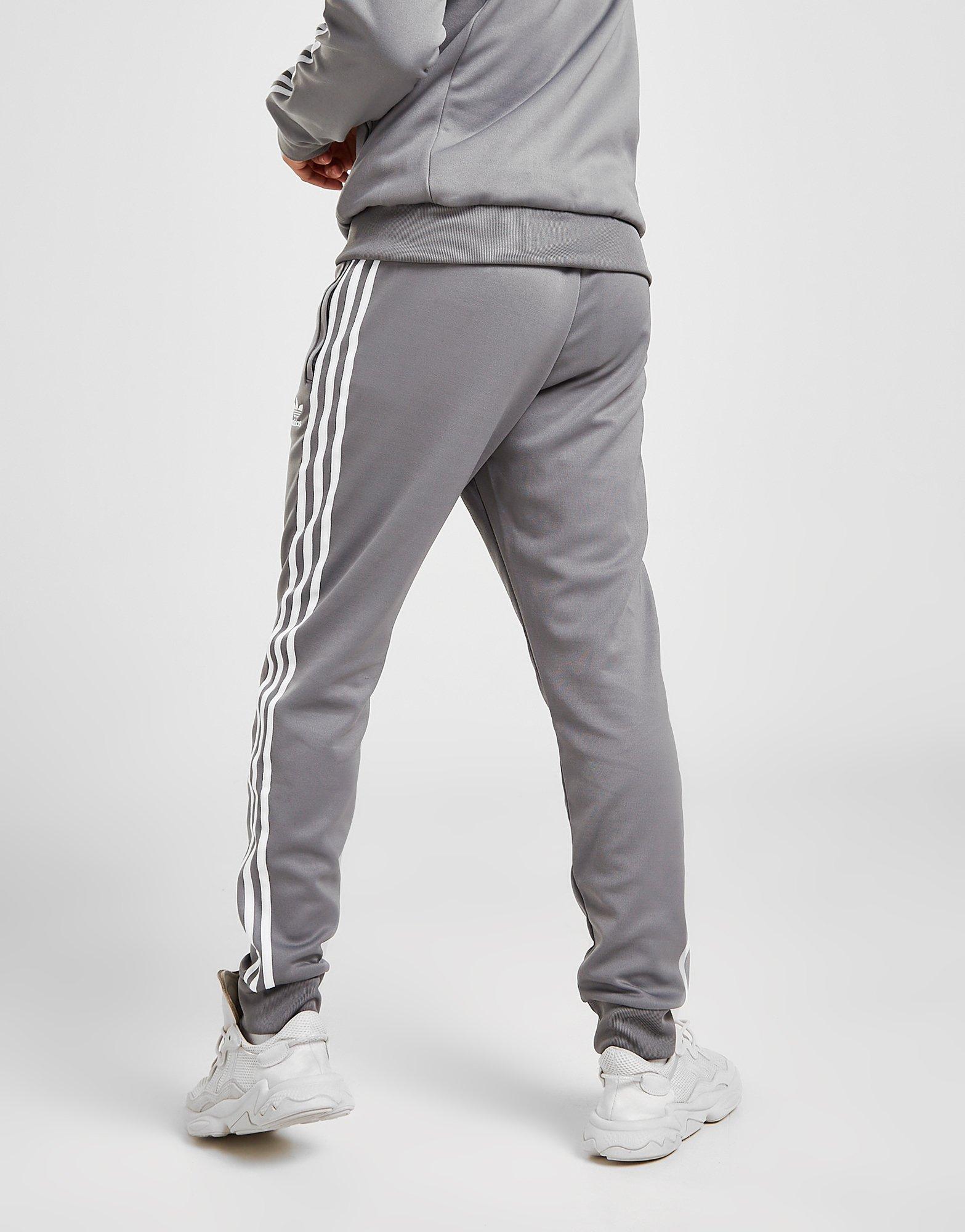 Pánske nohavice ADIDAS NOHAVICE  SS TRACK PANTS HB5900 Sivá