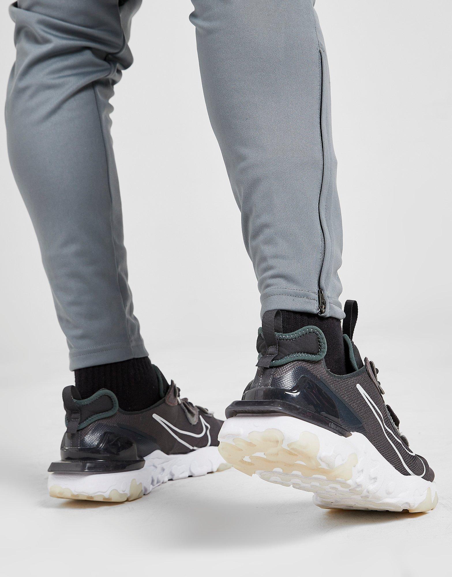 Pantaloni pentru bărbați NIKE PANTALONI  NEXT GEN ACADEMY TRACK PANTS BV6920086 Gri