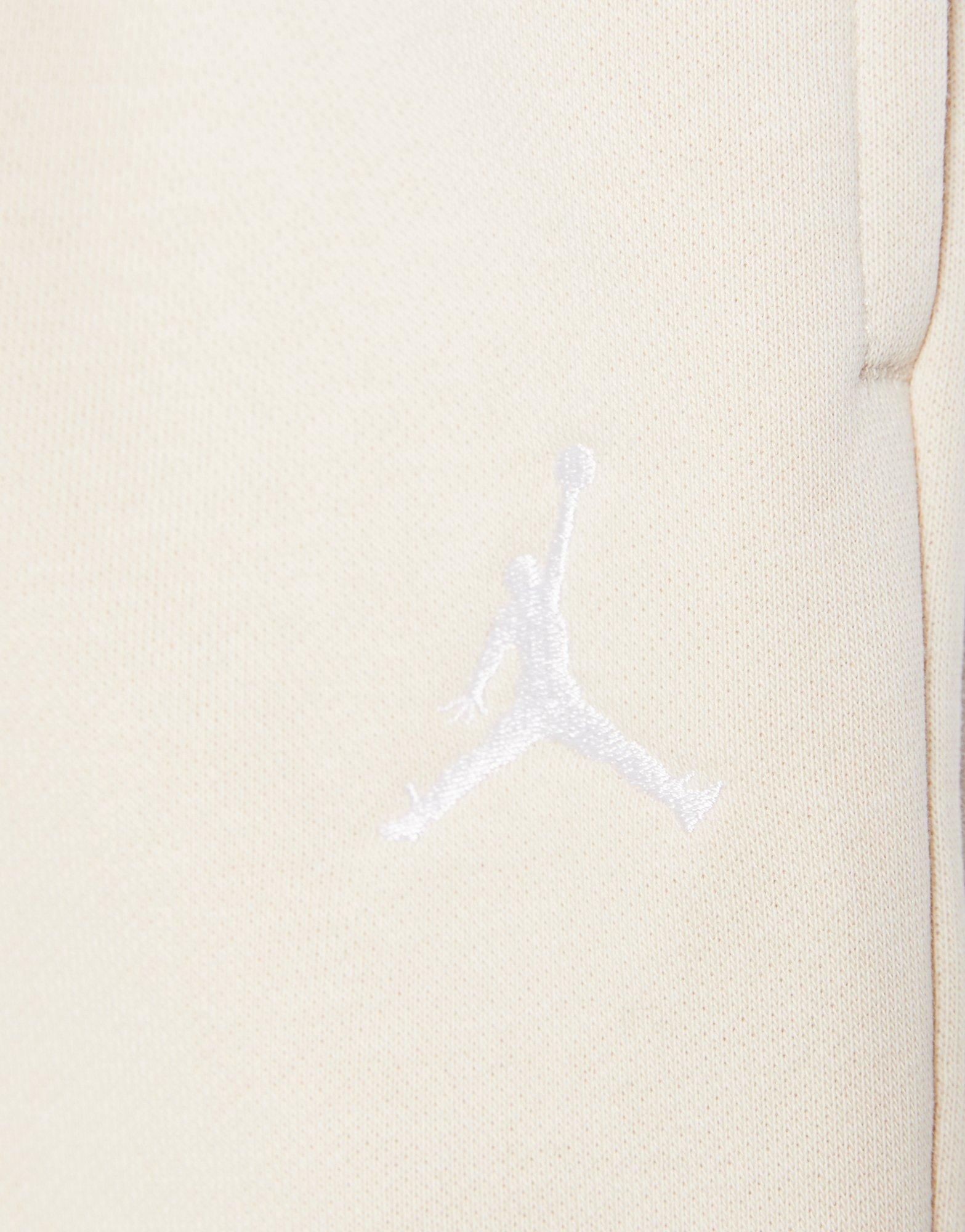 Detské nohavice JORDAN NOHAVICE  WJ BRKN FLC PANT 45F138-XAE Béžová