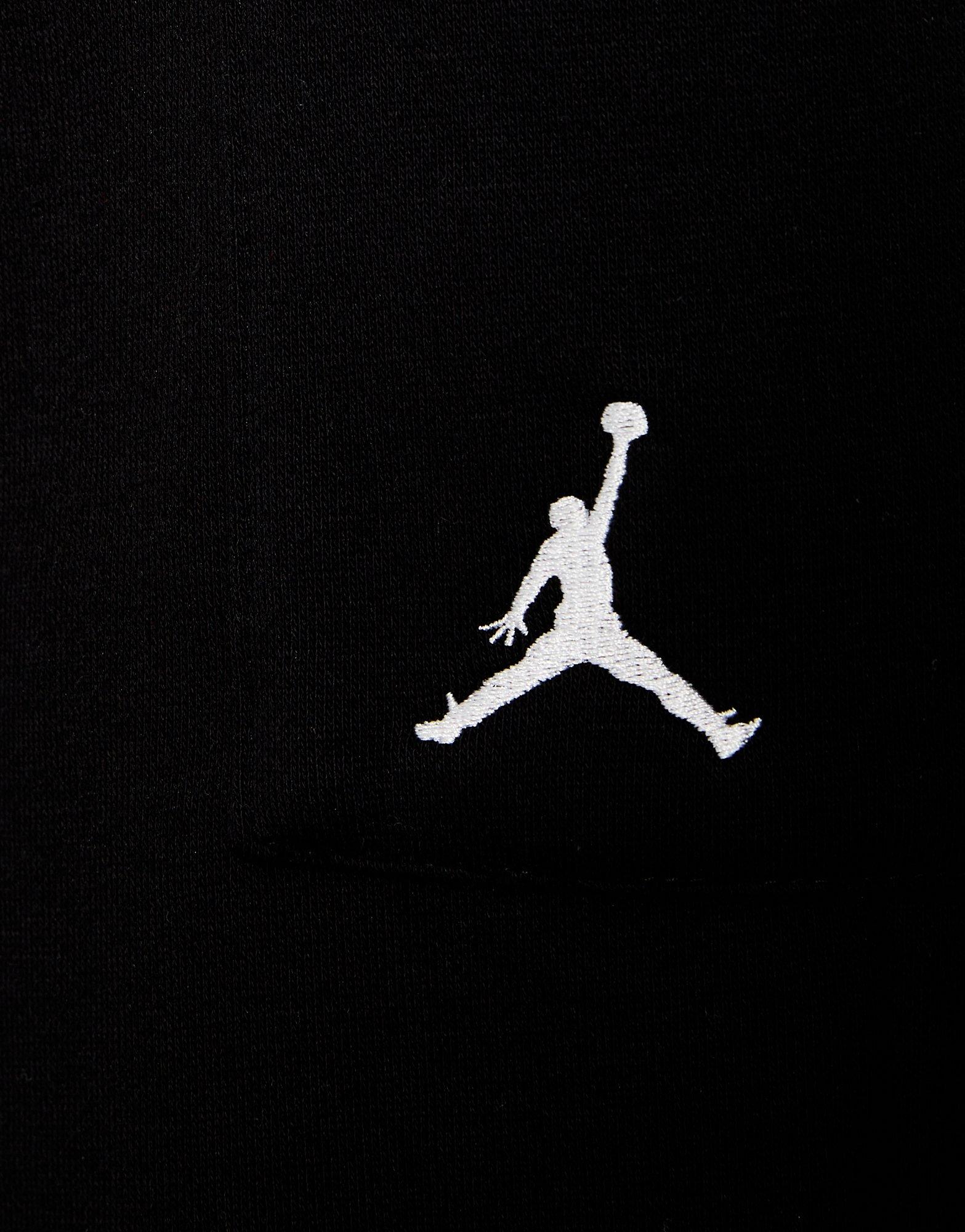 Detské nohavice JORDAN NOHAVICE  WJ BRKN FLC CARGO PANT 45F142-023 Čierna