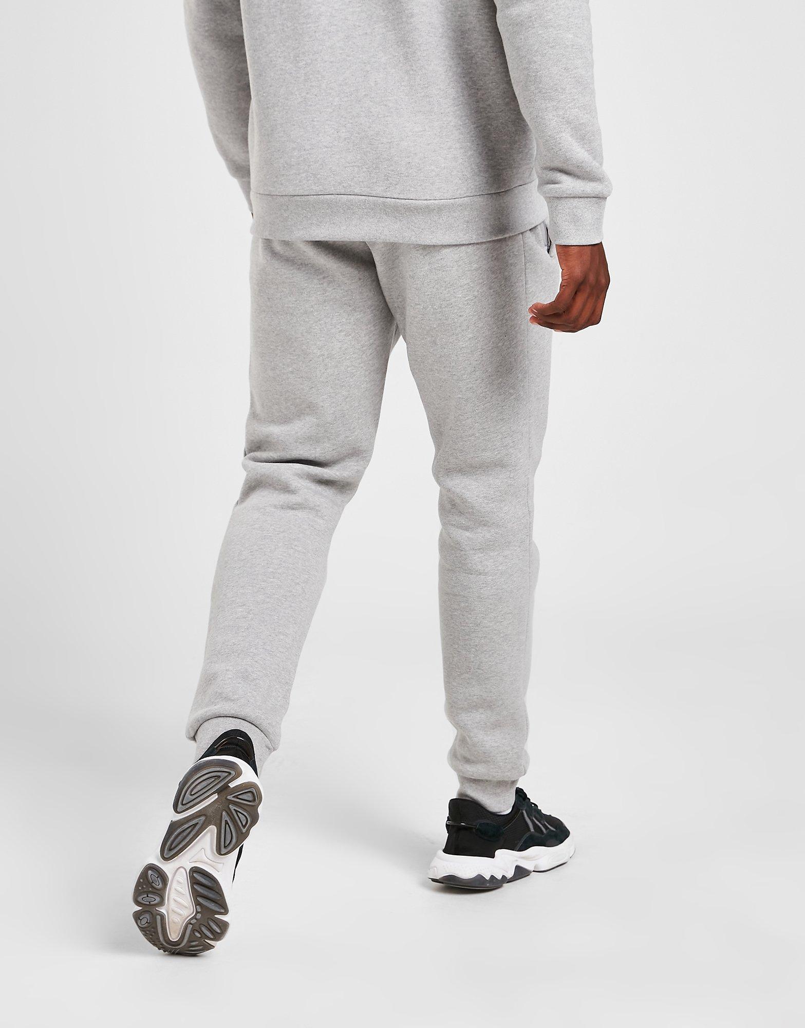 Pantaloni pentru bărbați ADIDAS TREFOIL ESSENTIAL JOGGERS  H34659 Gri