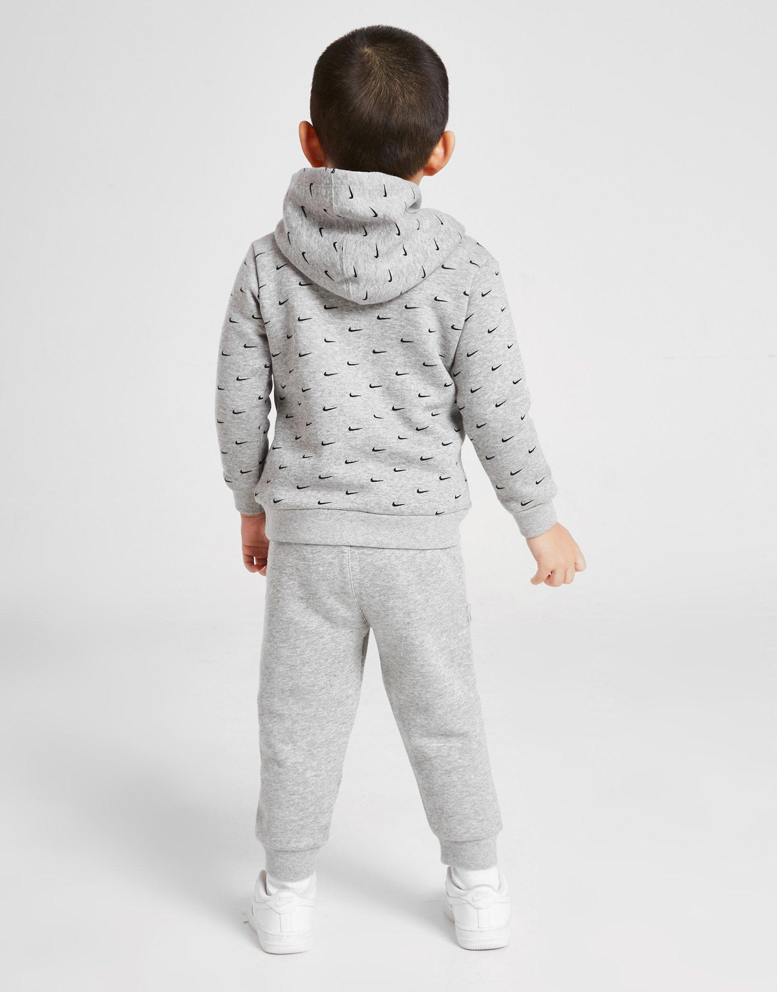 Trening pentru copii NIKE TRENING ALL OVER PRINT SWOOSH OVERHEAD TRACKS 56I434042 Gri