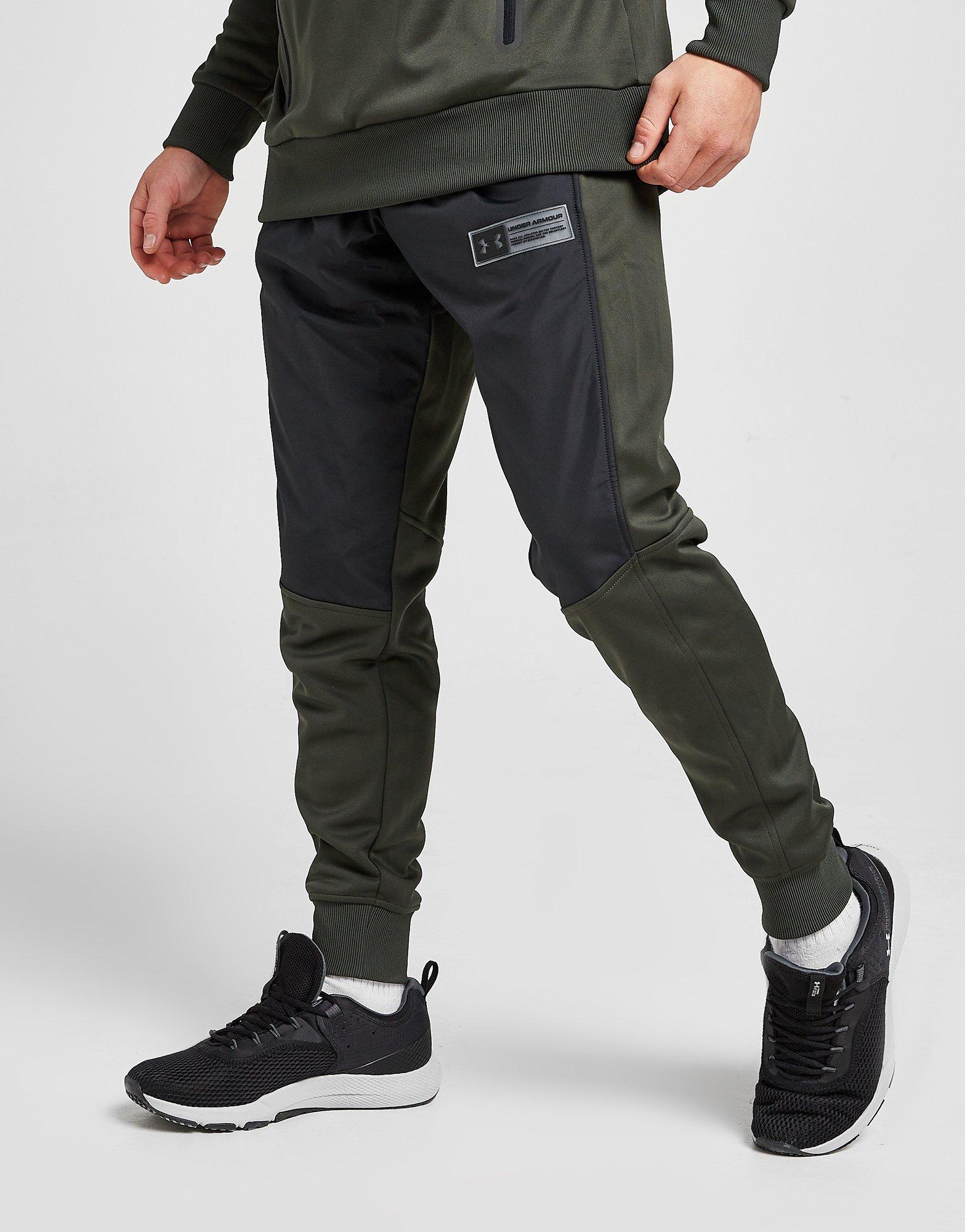 Pánske nohavice UNDER ARMOUR NOHAVICE  UA ARMOUR FLEECE TRACK PANT 1365569-310 Čierna