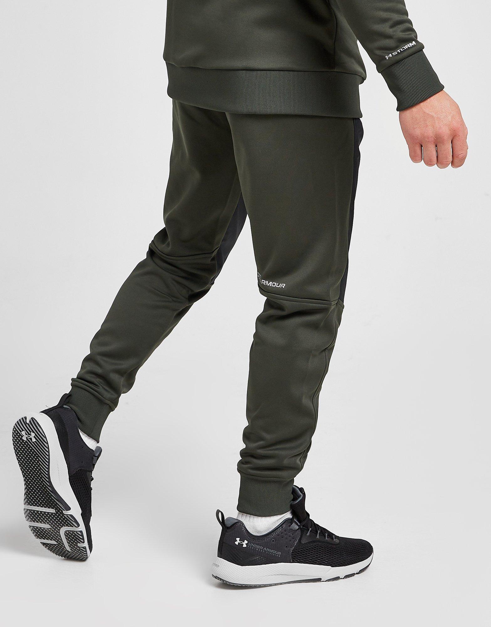 Pánske nohavice UNDER ARMOUR NOHAVICE  UA ARMOUR FLEECE TRACK PANT 1365569-310 Čierna