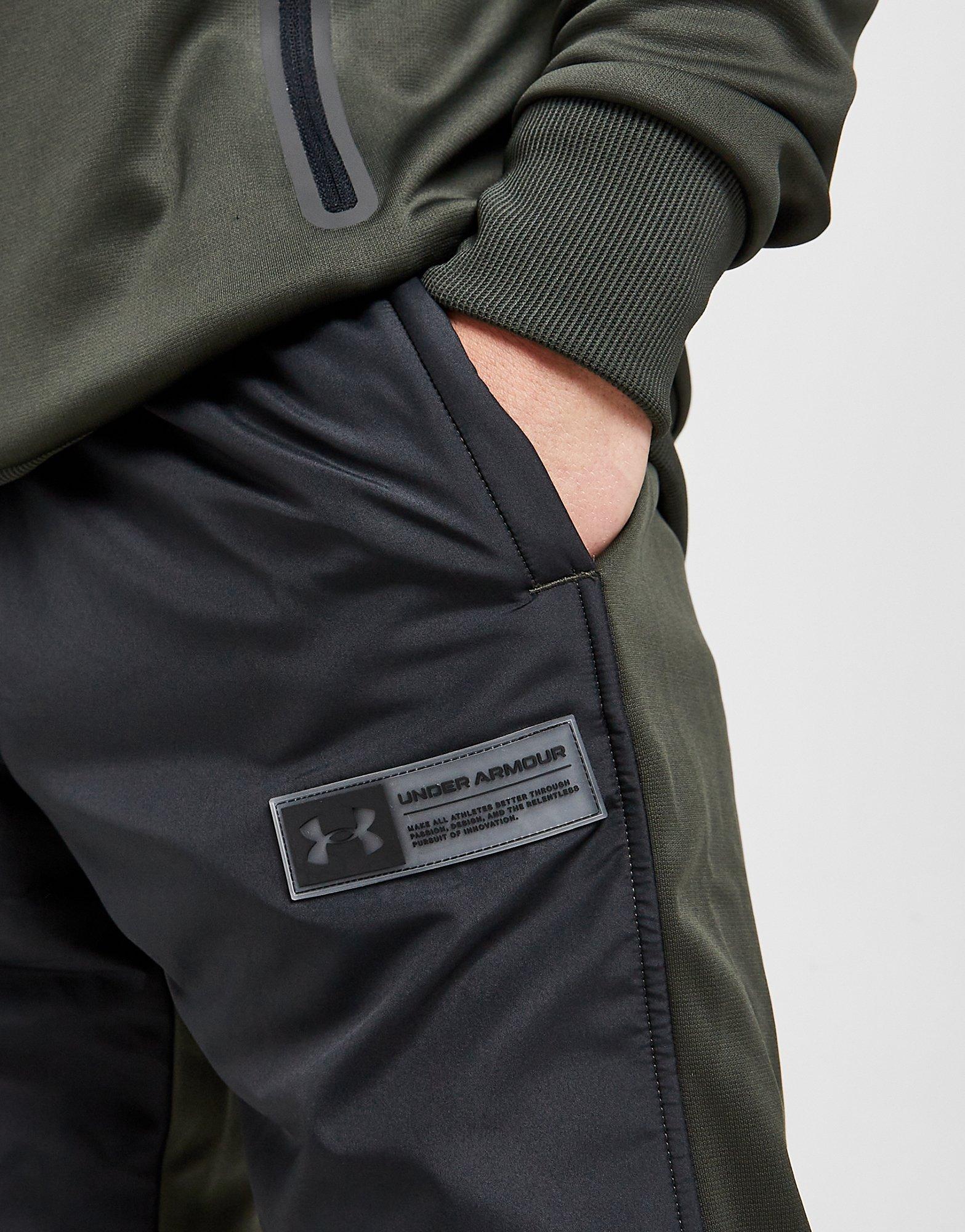 Pánske nohavice UNDER ARMOUR NOHAVICE  UA ARMOUR FLEECE TRACK PANT 1365569-310 Čierna