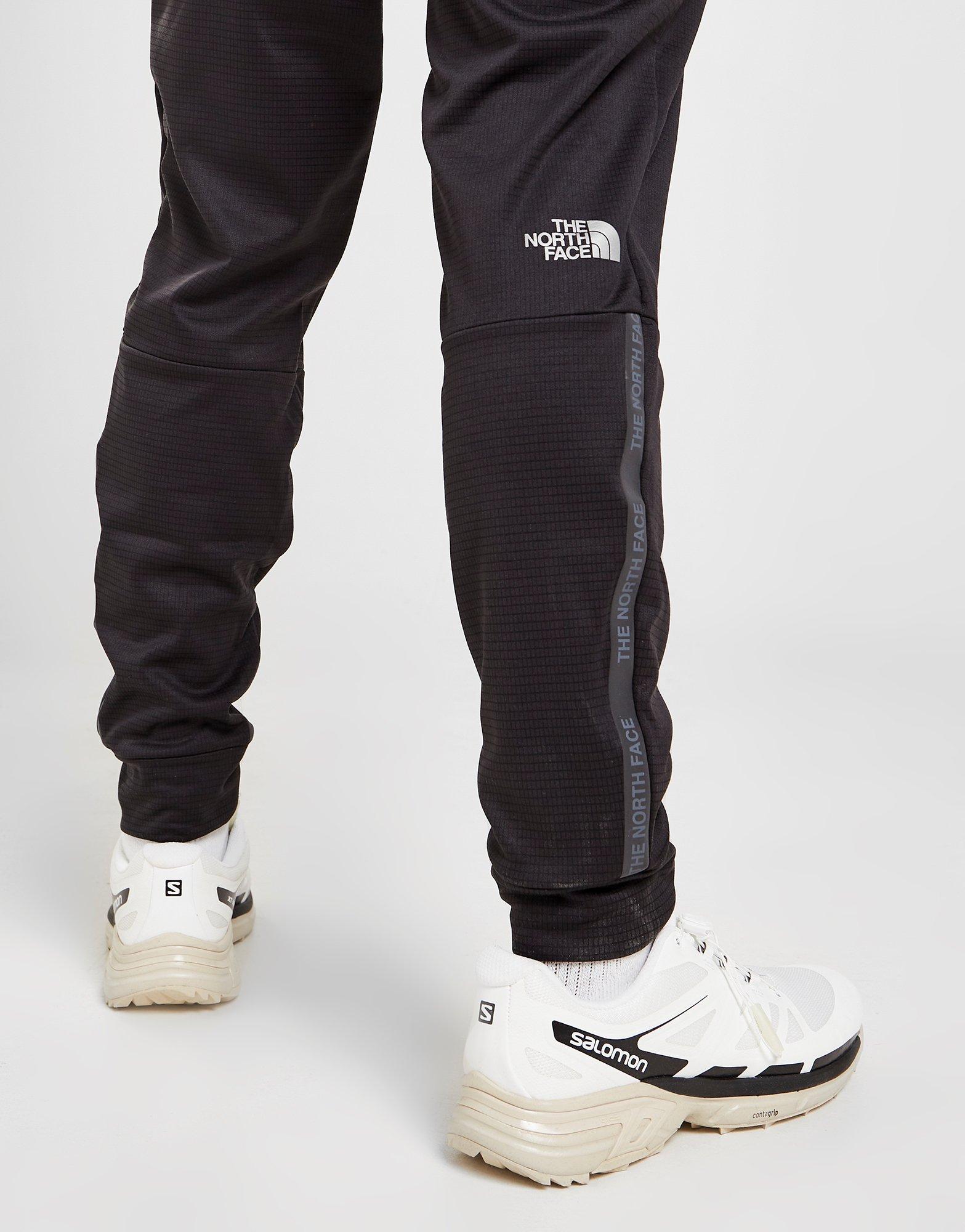 Pánske nohavice THE NORTH FACE TRAIN N LOGO TRACK PANTS  NF0A7ST6JK31 Čierna