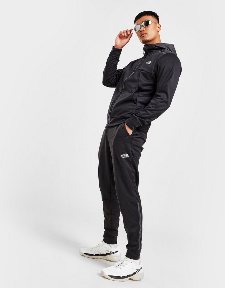 Pánske nohavice THE NORTH FACE TRAIN N LOGO TRACK PANTS  NF0A7ST6JK31 Čierna