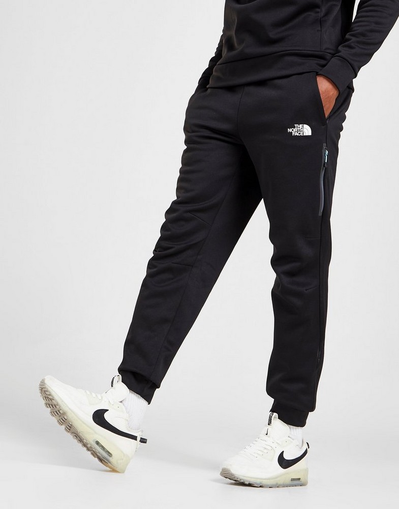 Pantaloni pentru bărbați THE NORTH FACE PANTALONI DE   TRENING  MITTELLEGI JOGGERS  NF0A55CMKY41 Negru