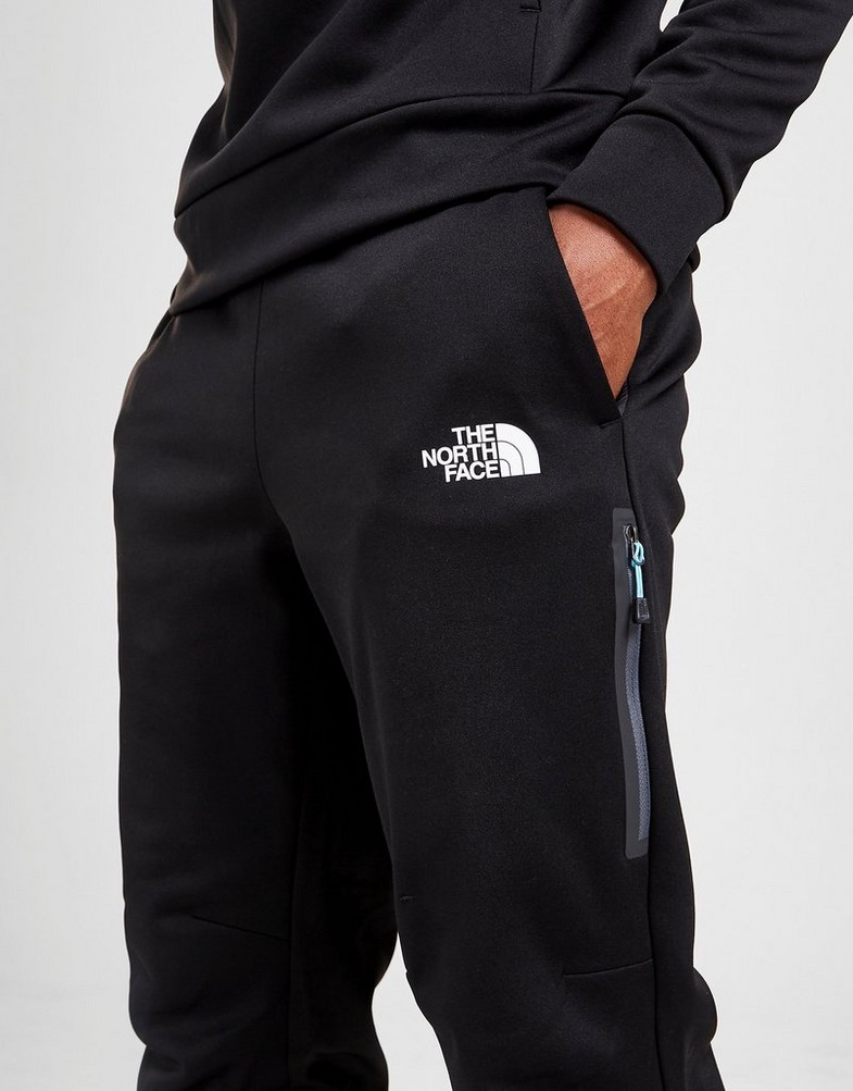 Pantaloni pentru bărbați THE NORTH FACE PANTALONI DE   TRENING  MITTELLEGI JOGGERS  NF0A55CMKY41 Negru