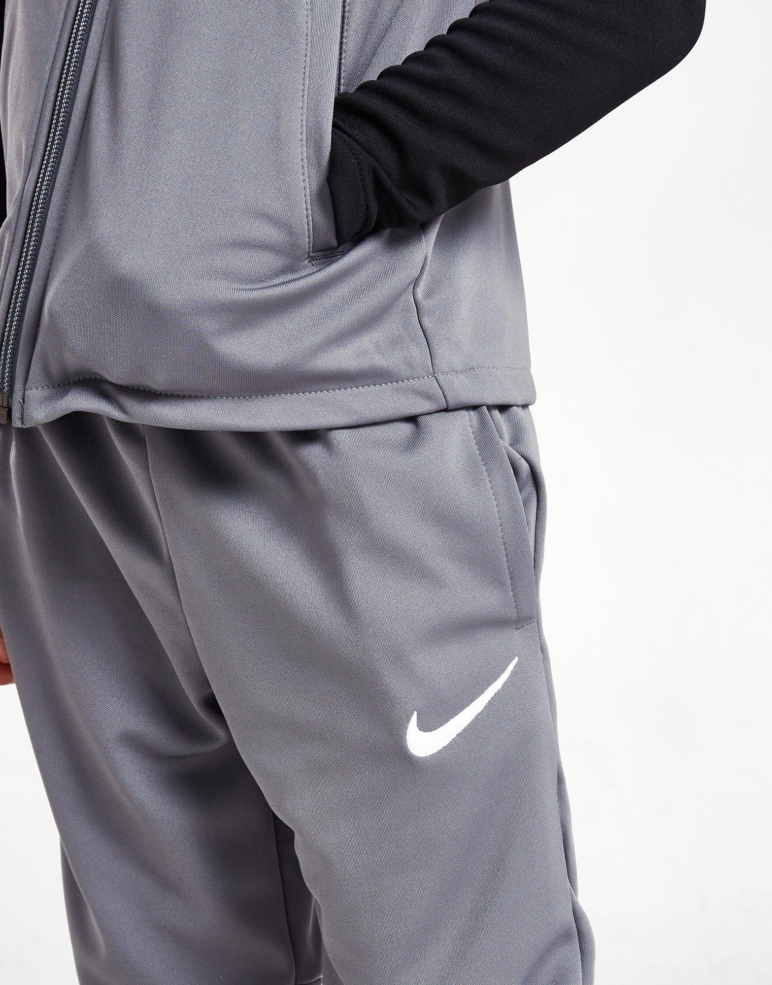 Vaikiški sportiniai kostiumai NIKE ACADEMY FULL ZIP TRACKSUIT CHILDREN  4J3363-084 Pilka