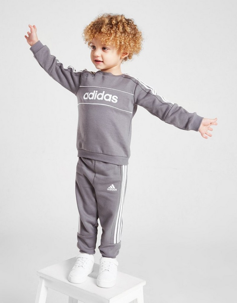 Detská tepláková súprava ADIDAS DRES LINEAR LOGO ESSENTIAL TRACKSUIT INFAN HI1138 Sivá