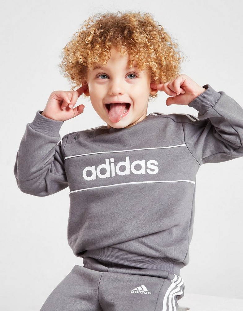 Detská tepláková súprava ADIDAS DRES LINEAR LOGO ESSENTIAL TRACKSUIT INFAN HI1138 Sivá
