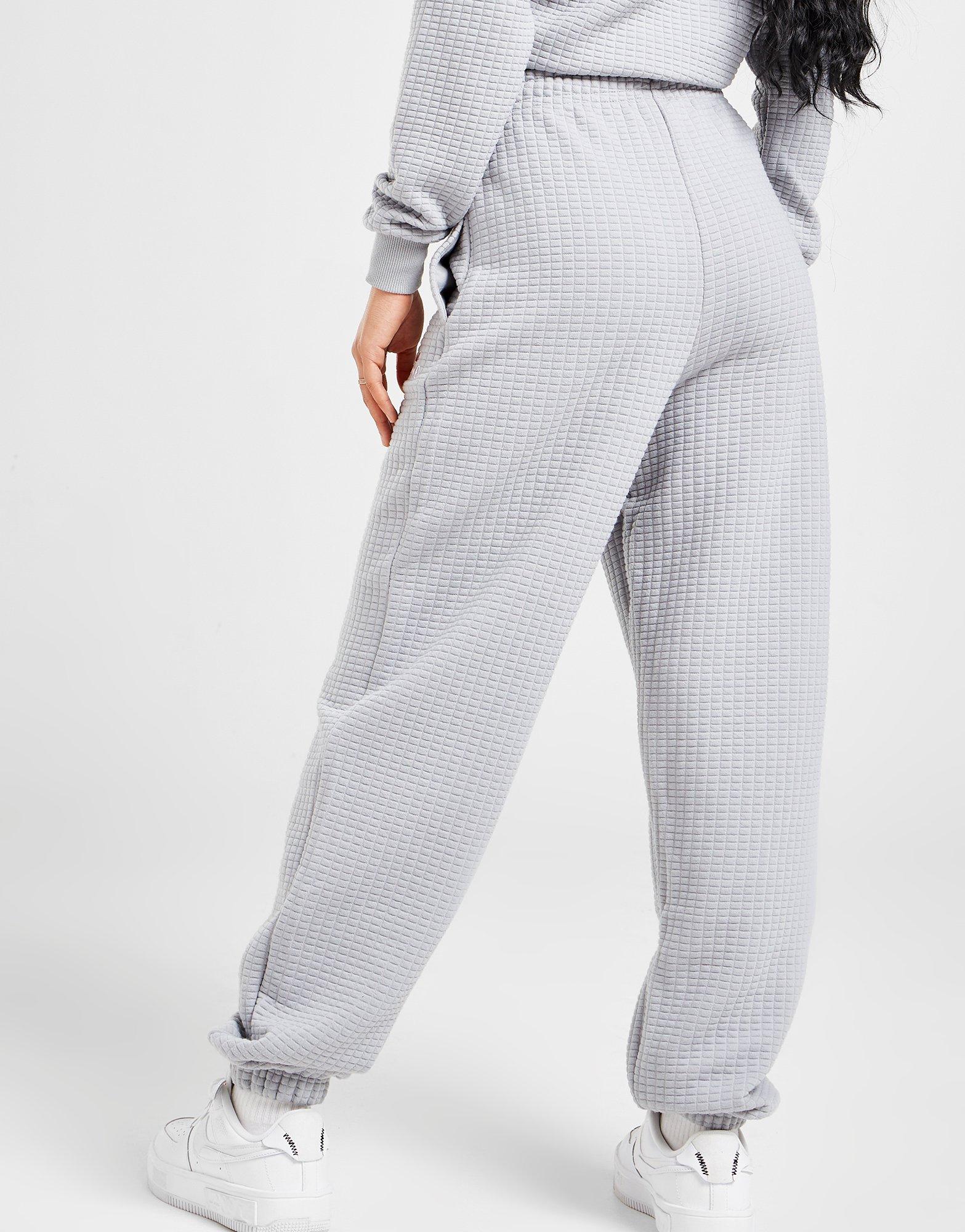 Dámske nohavice ELLESSE NOHAVICE  WAFFLE JOGGERS SJD13767GRY Sivá