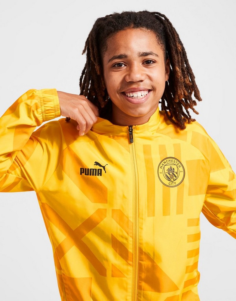 Koszulka, t-shirt dziecięcy PUMA KRÓTKI RĘKAW MANCHESTER CITY FC PRE-MATCH JACKET JUNIOR 76778609 Złoty
