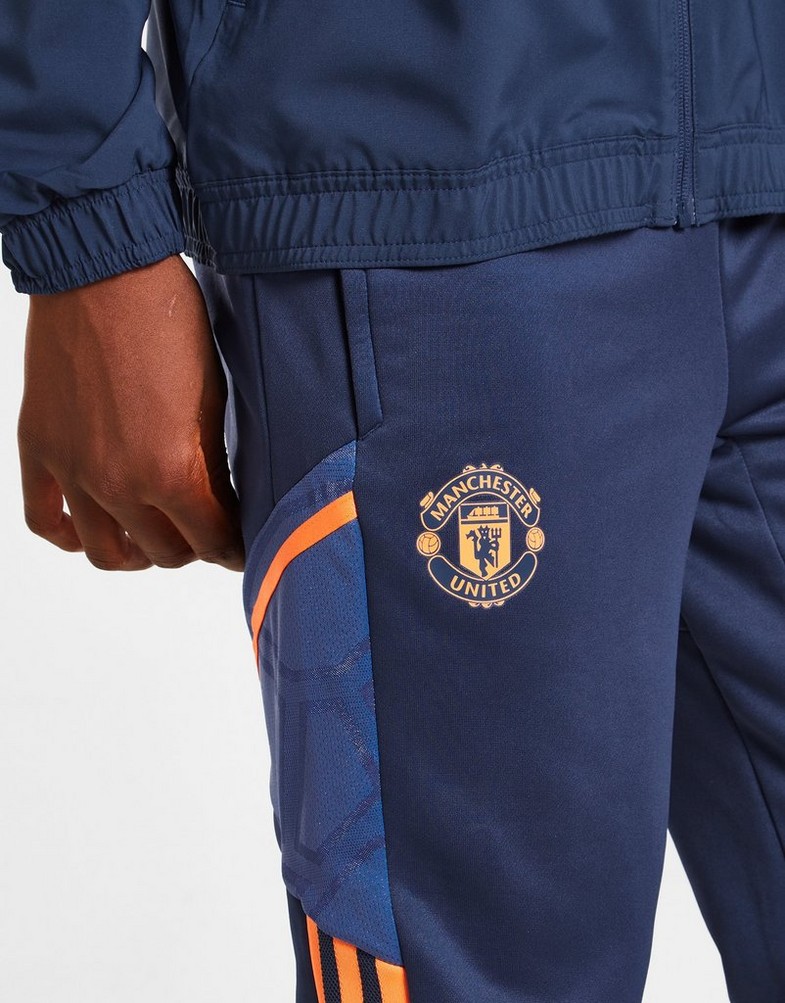 Komplet dresowy dziecięcy ADIDAS DRES MANCHESTER UNITED FC TRAINING TRACK PANTS JUNIOR HH9324 Granatowy