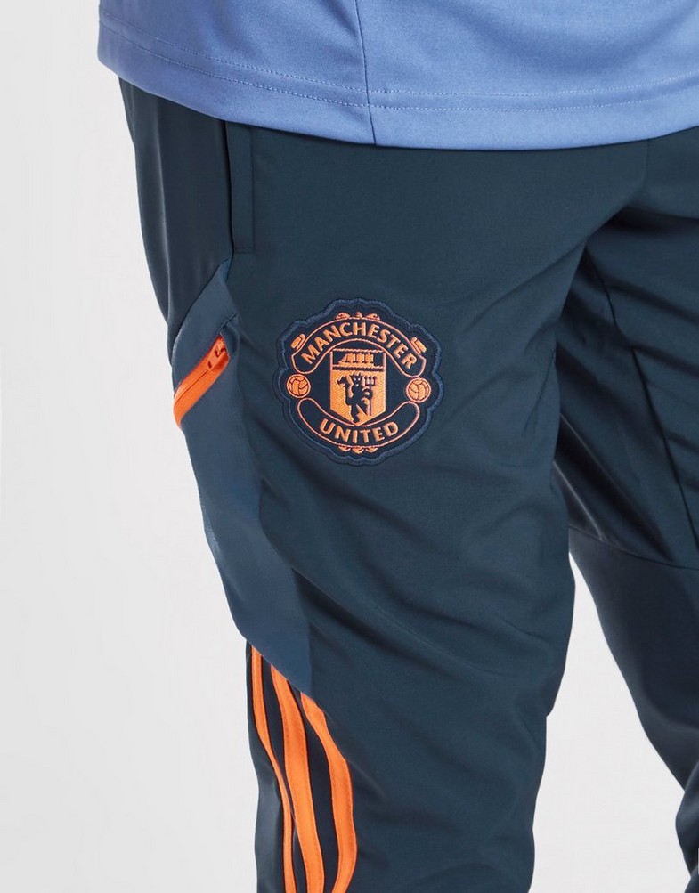 Komplet dresowy dziecięcy ADIDAS DRES MANCHESTER UNITED PRESENTATION TRACK PANTS JUNIOR HH9330 Granatowy